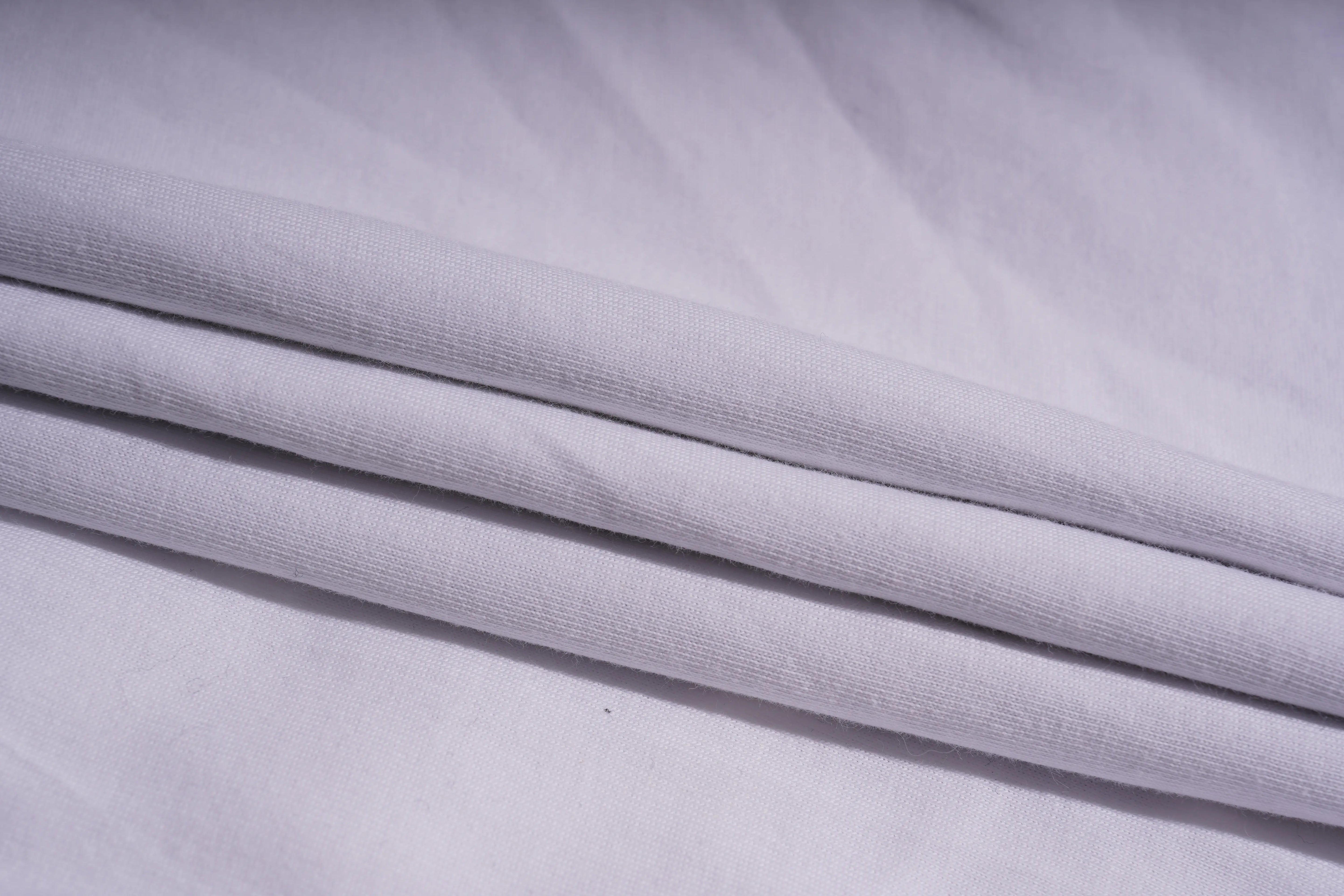 Stack of light gray fabric with a textured surface TCH Rhinestone Puppy Bow White T-Shirt-