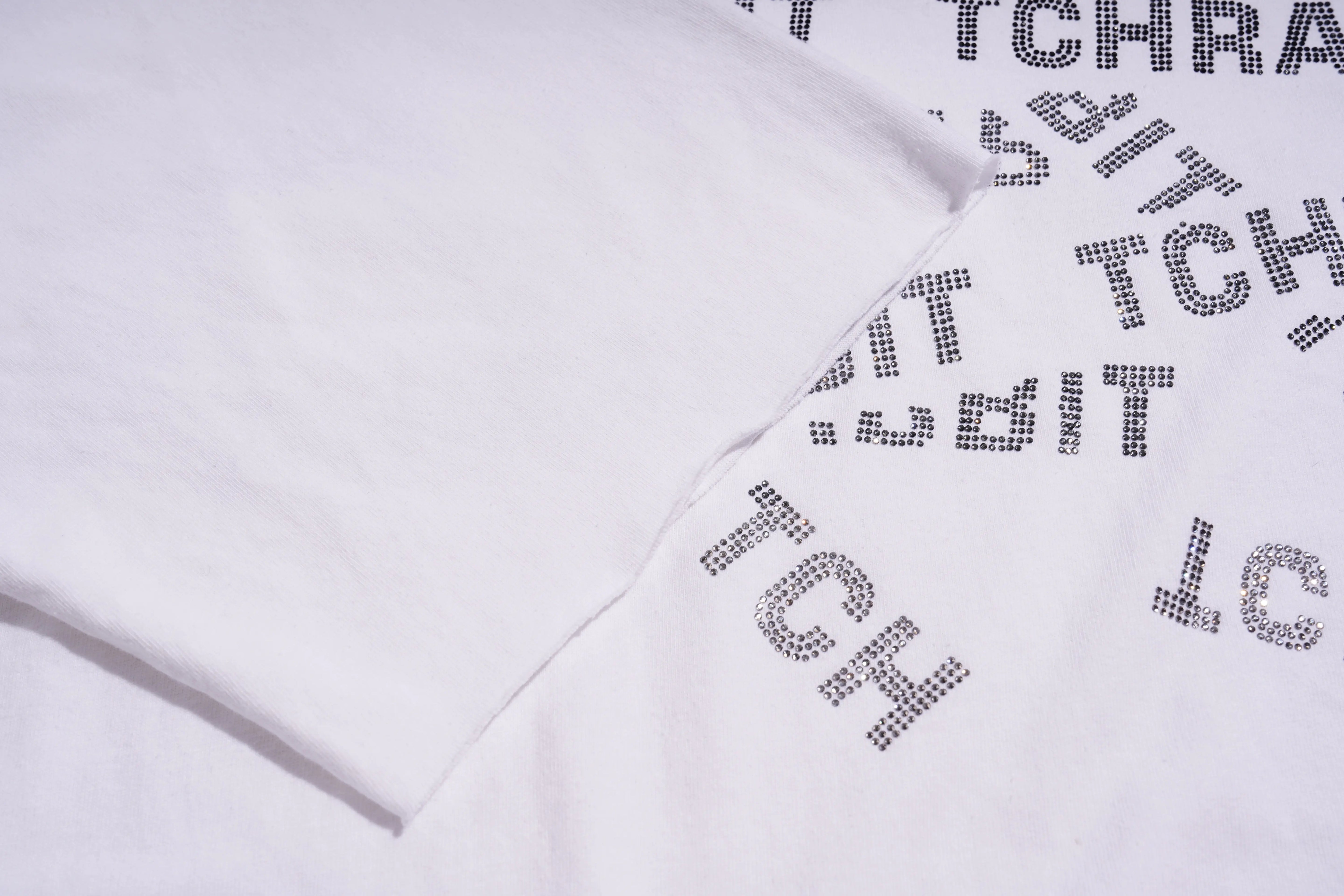 White sweatshirt with black text and rhinestone accents on a white background, TCH All-Over TCHRABBIT Logo T-Shirt
