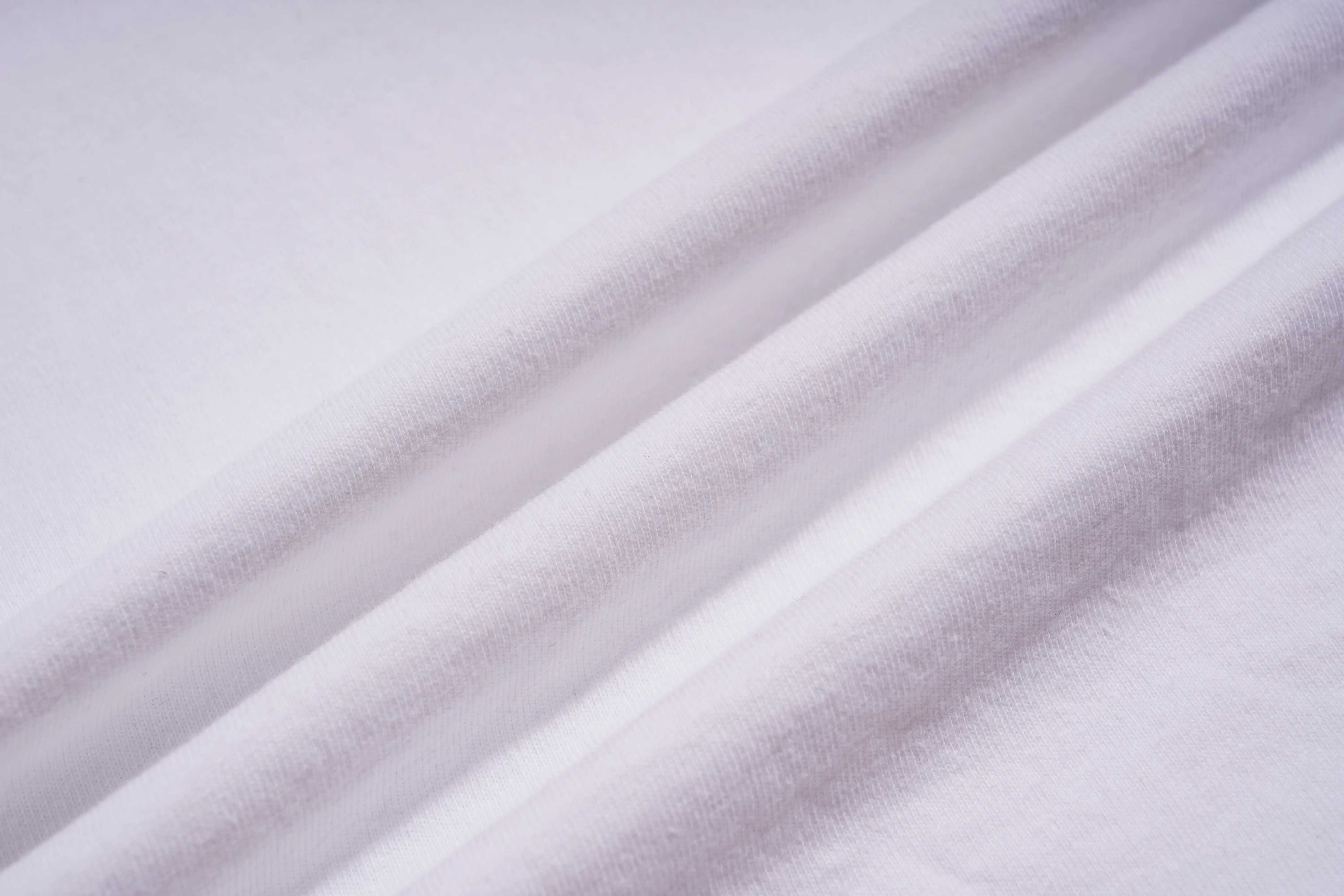 Close-up of light purple fabric with folds, TCH All-Over TCHRABBIT Logo T-Shirt