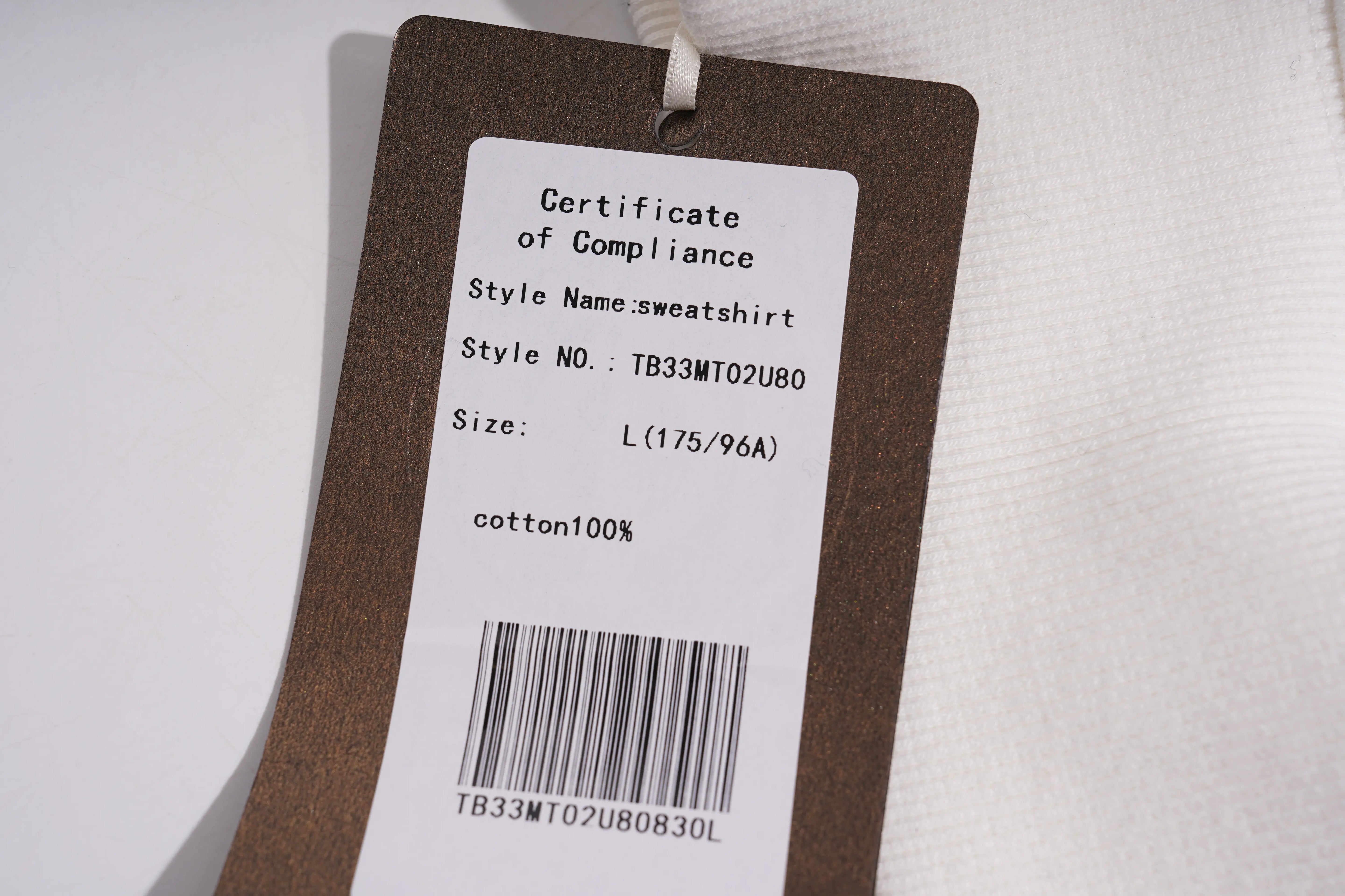 Clothing tag with certificate of compliance details on a white background, TCH BOY LONDON Rhinestone Logo Print Crew Neck Sweatshirt