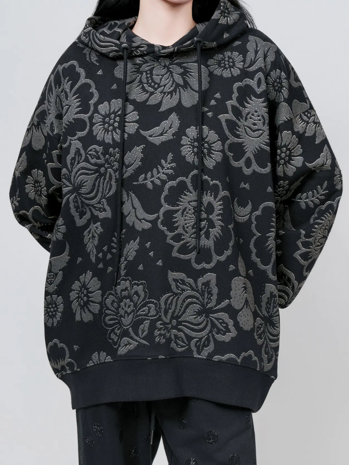 TCH Black Floral Embossed Graphic Hoodie TCH black floral hoodie Black floral graphic hoodie Textured floral hoodie Black botanical print hoodie Charcoal floral pullover Gothic floral streetwear hoodie Black patterned hoodie All-over floral print sweatshirt Dark aesthetic streetwear hoodie Graphic hooded sweatshirt