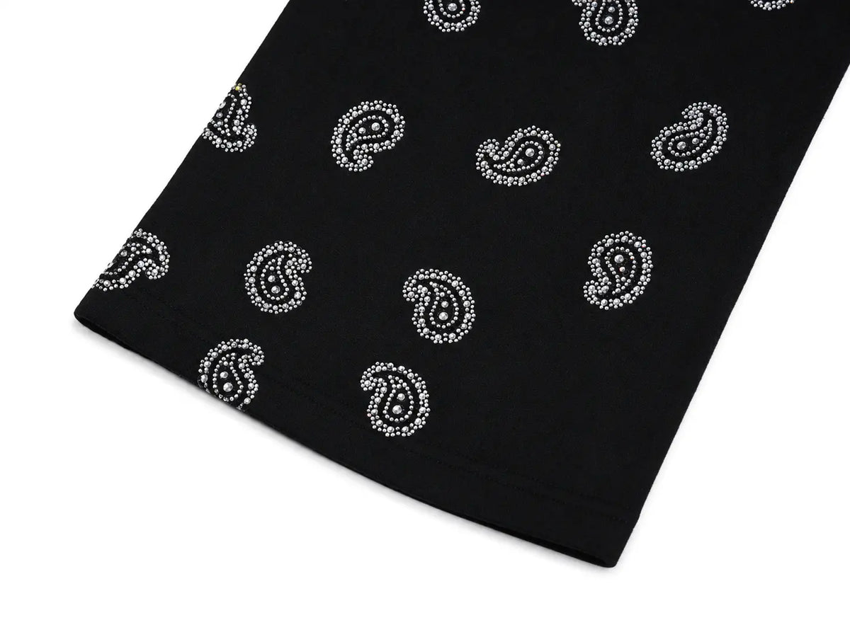 Black fabric with a repeating white paisley pattern, shown folded on a white background. TCH Black Paisley Print Wide-Leg Sweatpants