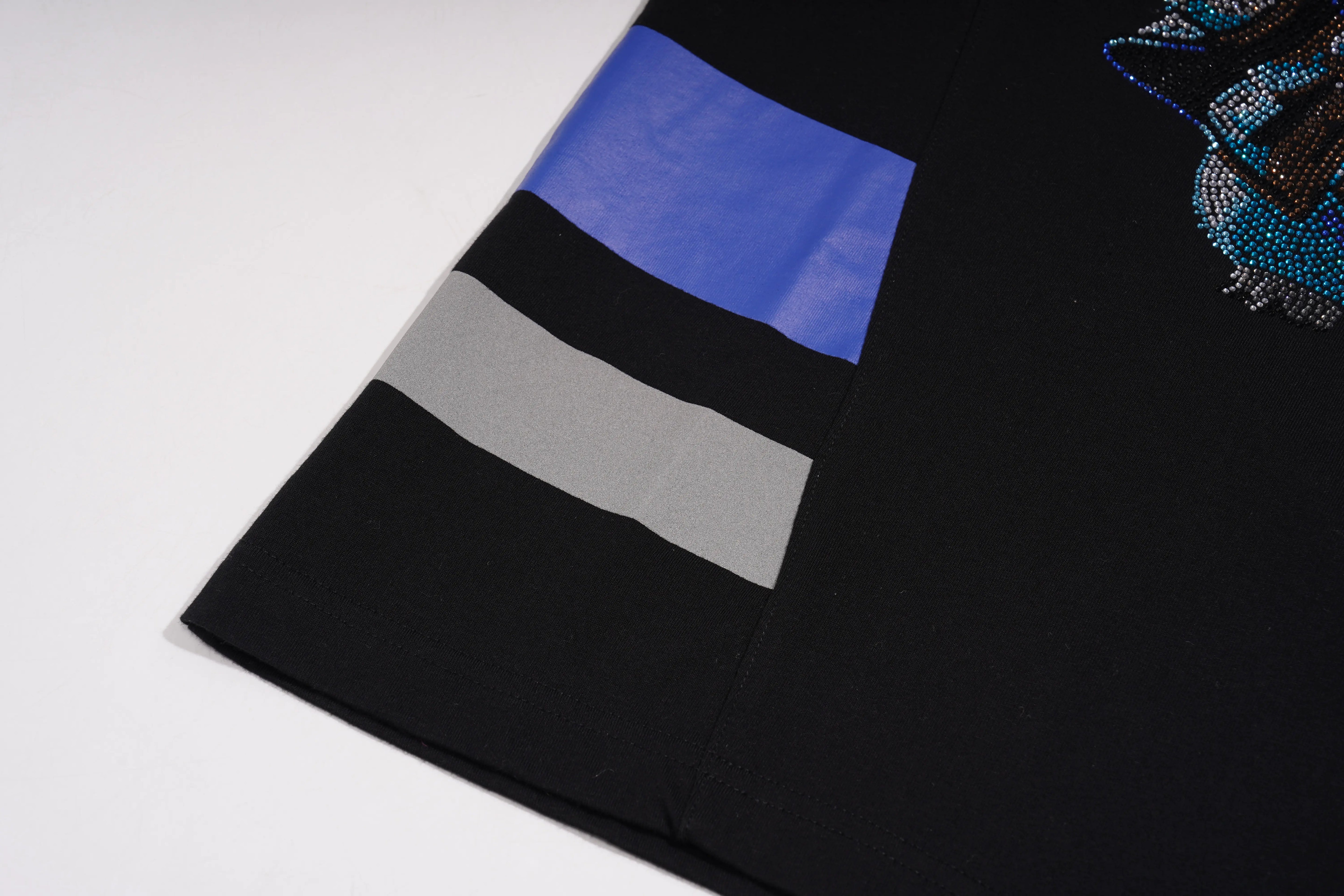 Black garment with blue and gray patch on a white background, TCH Black Rhinestone Cartoon Pig Sleeveless Top