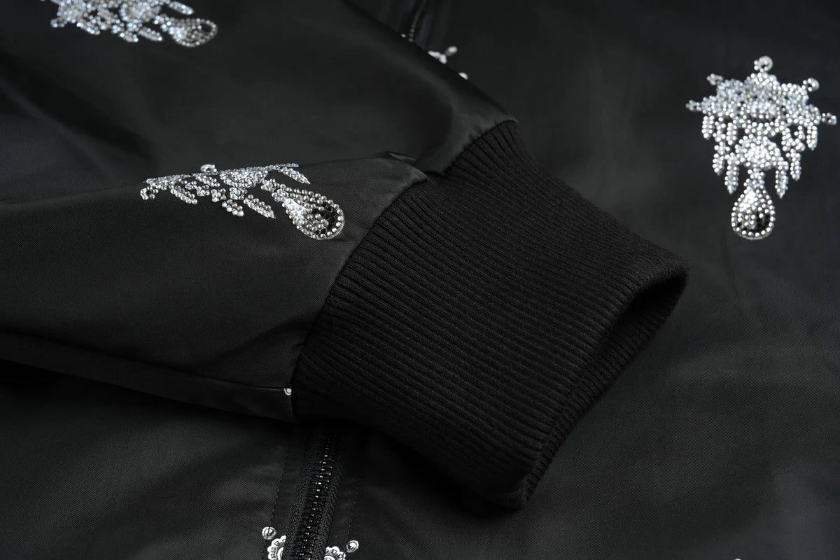 TCH Black Rhinestone Skull Print Bomber Jacket TCH black skull jacket Black skull print bomber jacket Gothic streetwear jacket Silver skull graphic jacket Black graphic bomber jacket All-over print black jacket Alternative fashion bomber jacket Skull pattern zip-up jacket Gothic black streetwear jacket TCH graphic bomber jacket