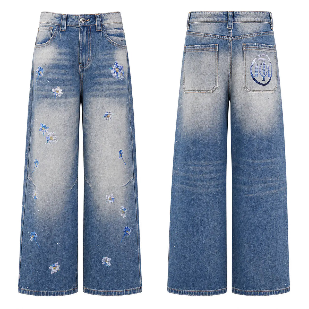Wide-leg denim jeans shown from the front and back on a white background. The front features a blue-to-light-gray ombre wash with scattered embroidered blue flowers, while the back shows a circular embroidered patch on the pocket and a similar gradient wash. TCH Blue Floral Rhinestone Wide-Leg Jeans