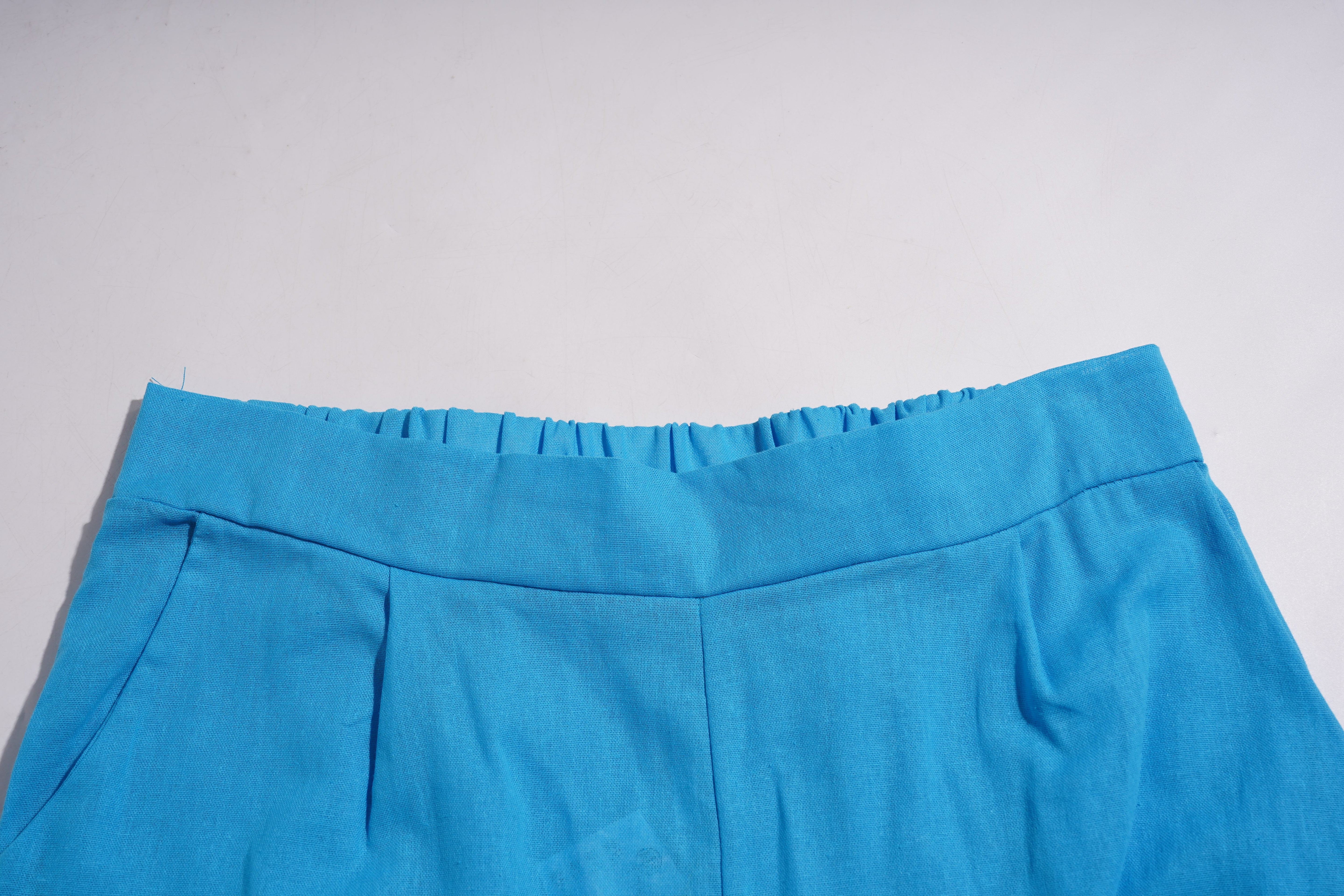 Close-up of a blue skirt with a plain background, TCH Blue Rhinestone Bow Matching Set