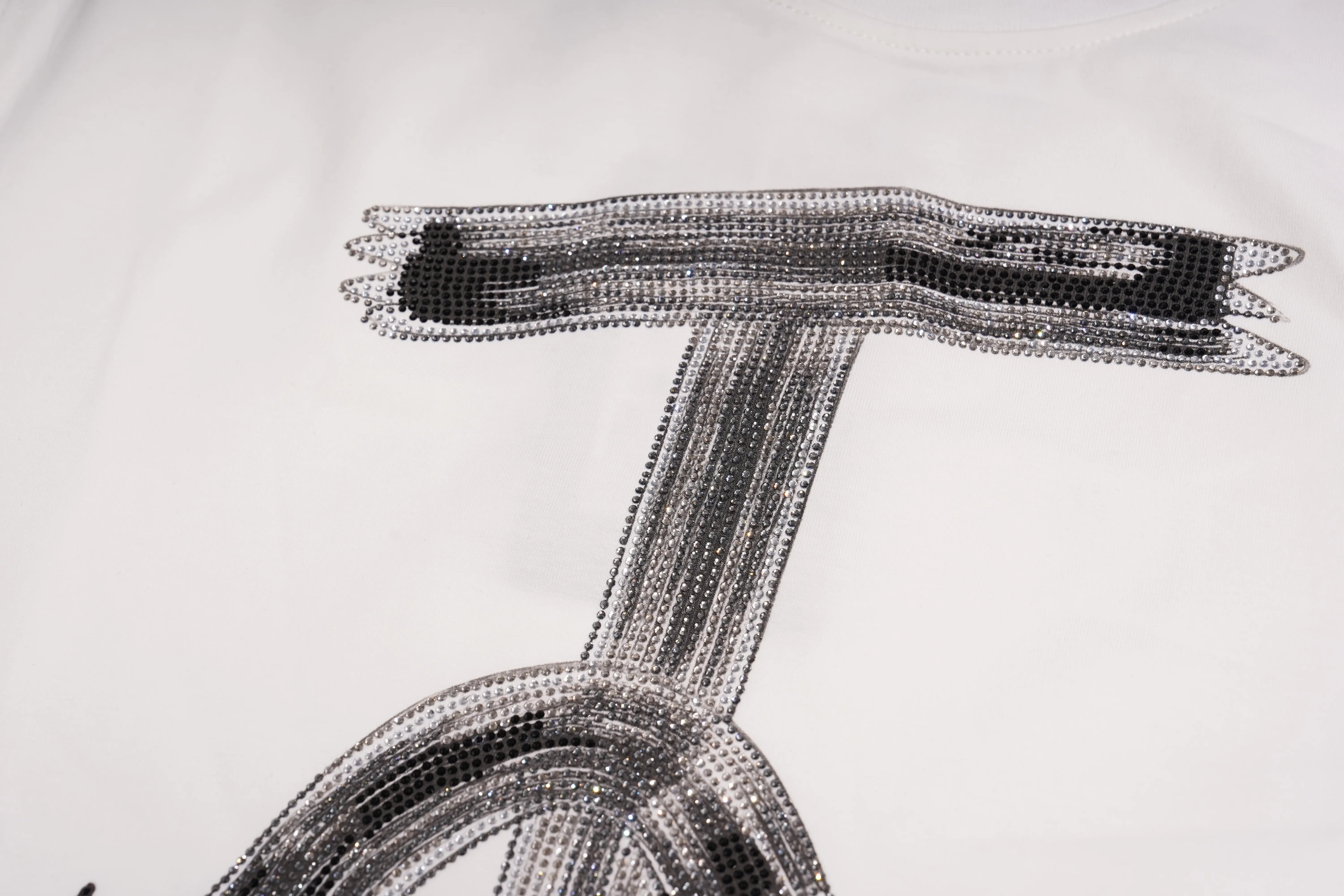 Close-up of a plain white crew-neck t-shirt showing the inner collar lining and ribbed neckline against a light gray background. TCH Brush Logo Graphic Oversized T-Shirt