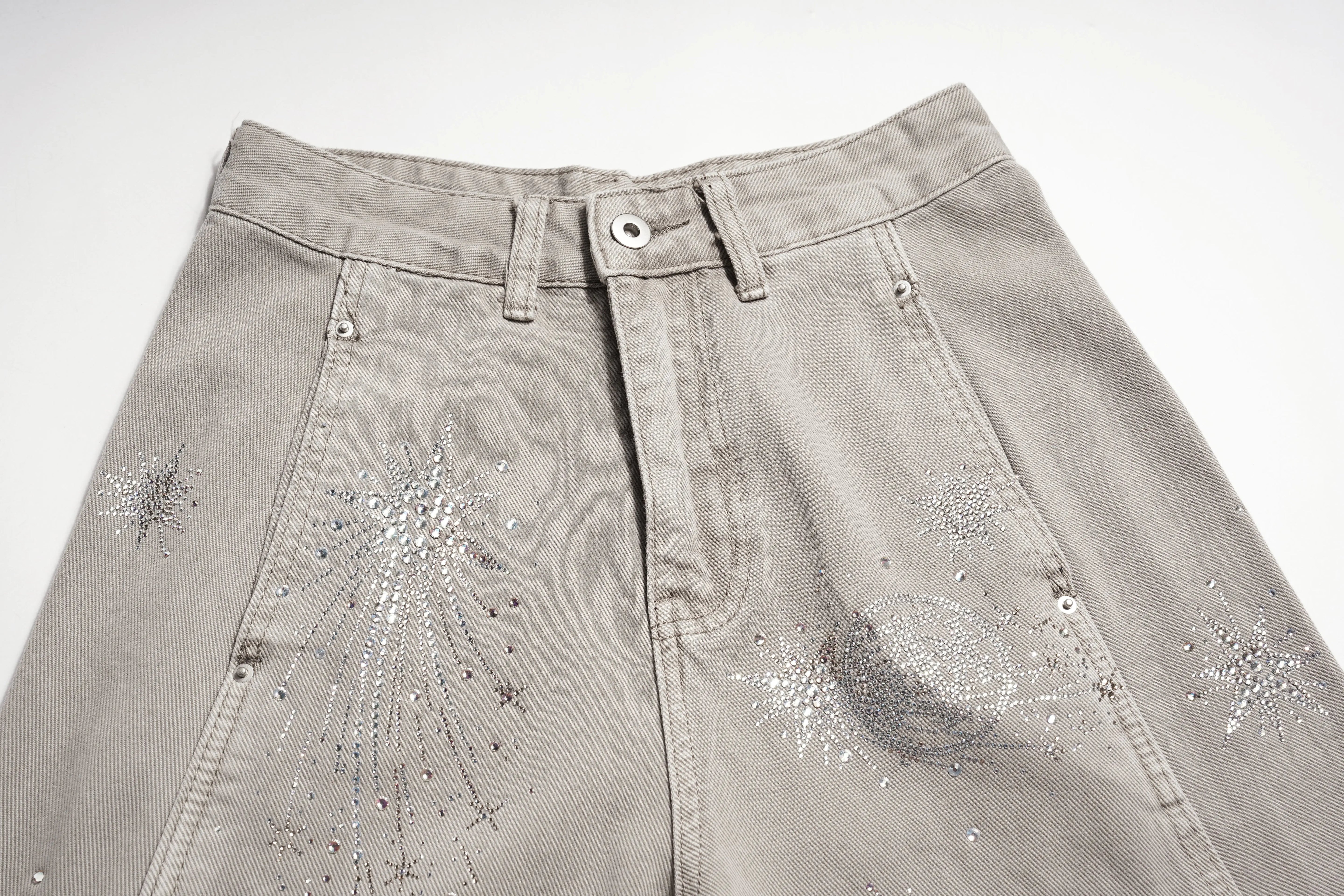 Beige jeans with star-shaped embellishments on a white background, TCH Celestial Firework Rhinestone Wide-Leg Pants