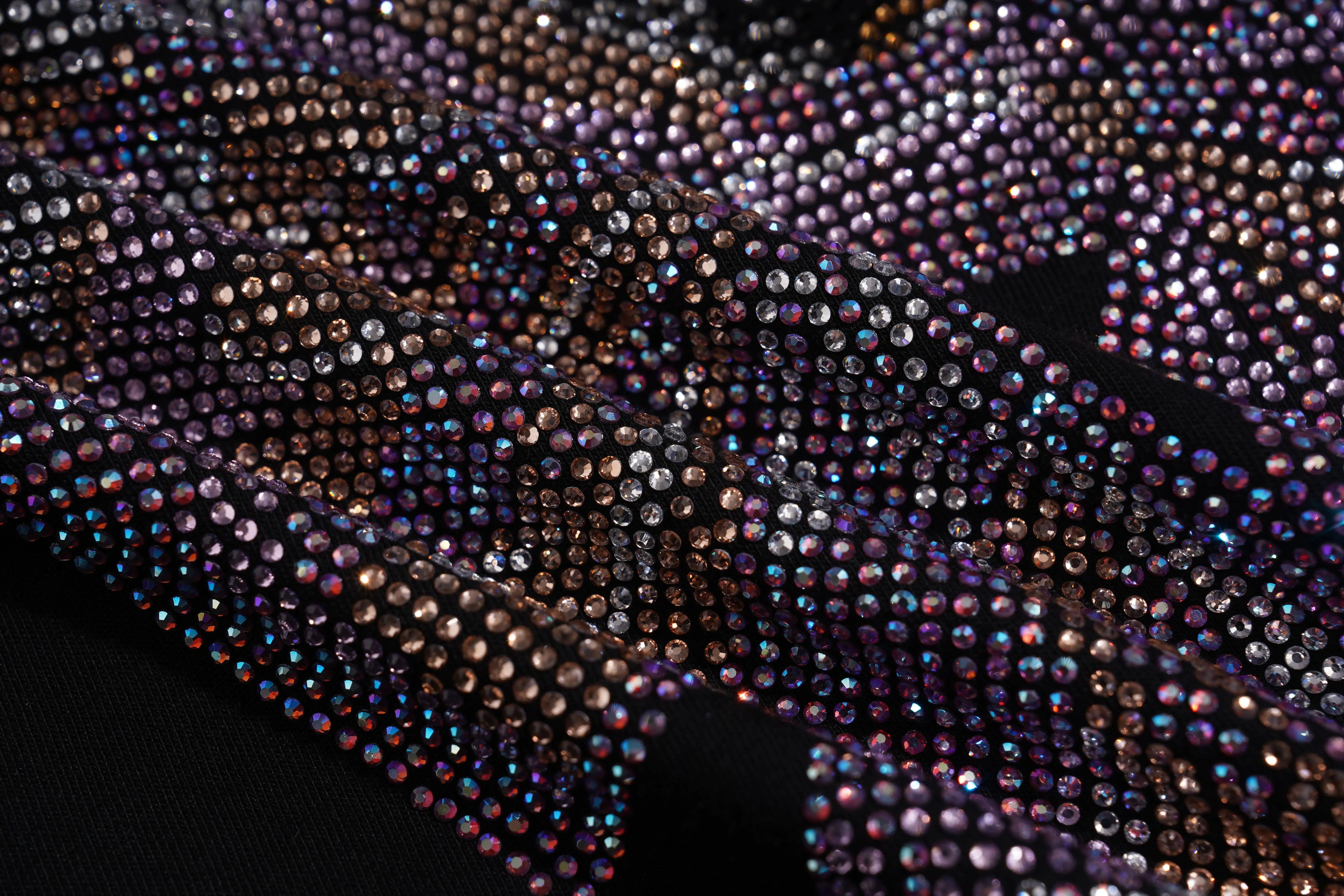 Close-up of a fabric with multicolored rhinestones on a black background, TCH Chihuahua Bow Rhinestone T-Shirt