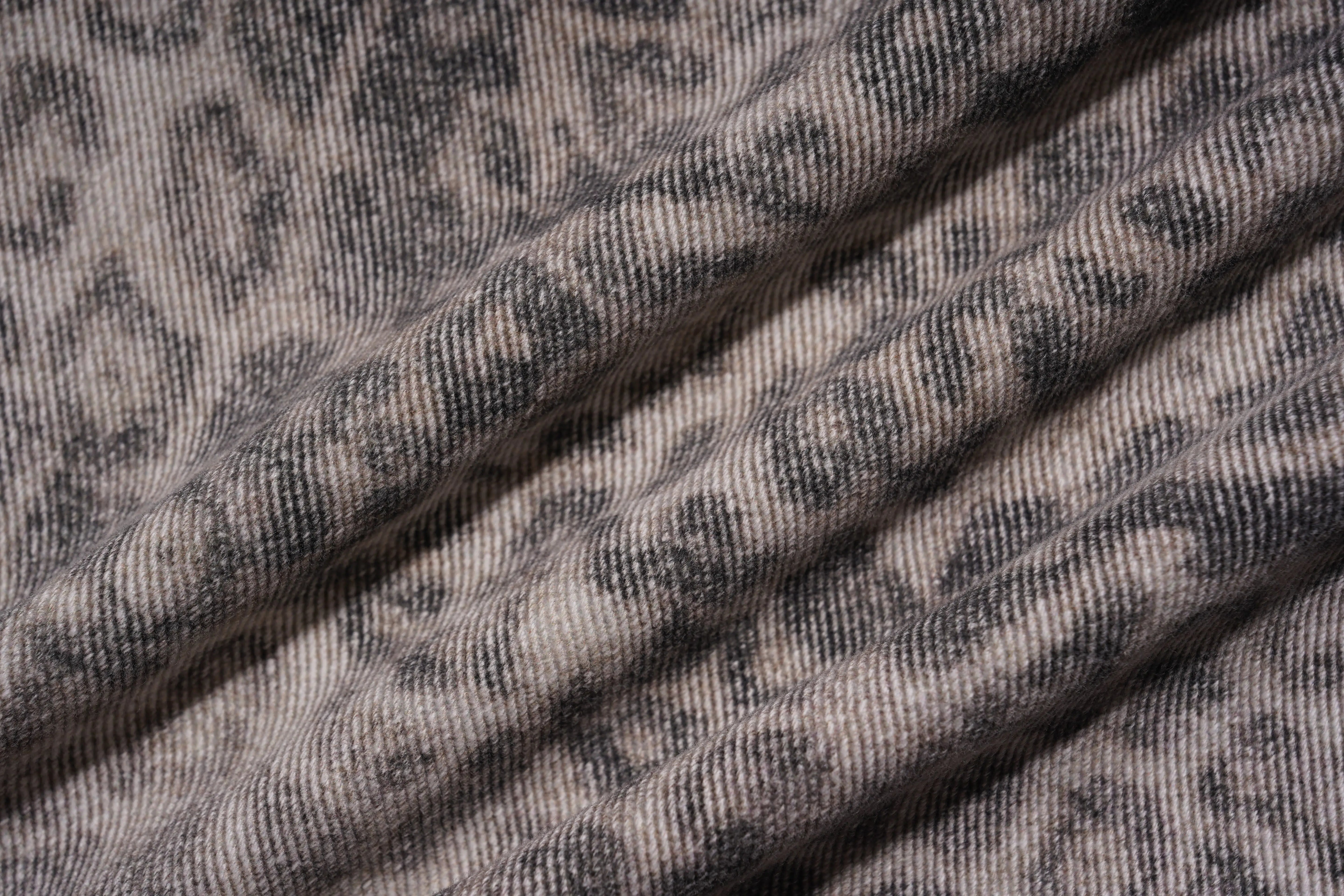 Close-up of textured fabric with a subtle pattern, TCH Cute Pony Rhinestone Grey Leopard Wide-Leg Jeans