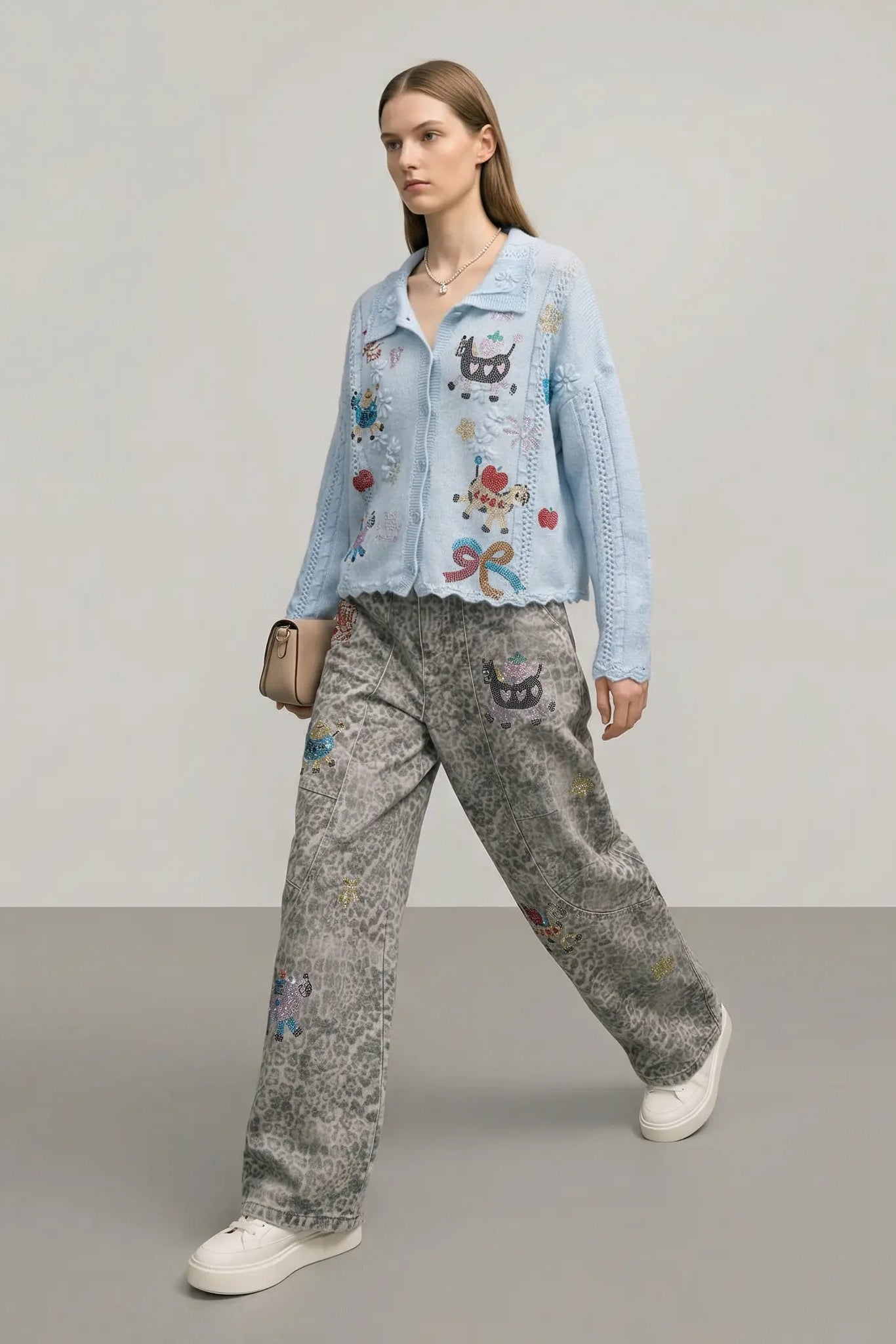 Woman wearing a light blue embroidered shirt and gray pants on a plain background, TCH Cute Pony Rhinestone Grey Leopard Wide-Leg Jeans