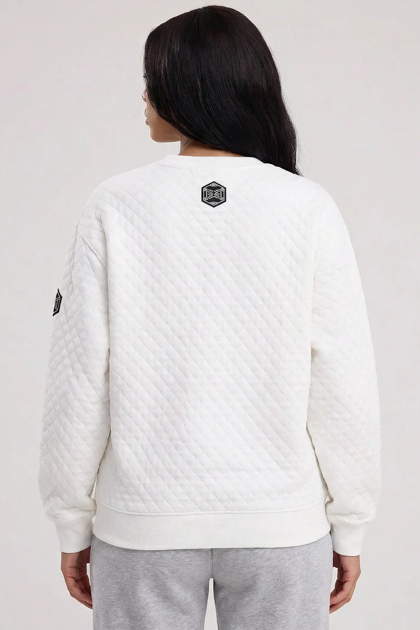 Person wearing a white quilted jacket with a logo on the back against a plain background, TCH Cute Rhinestone Fortune Pony Sweatshirt