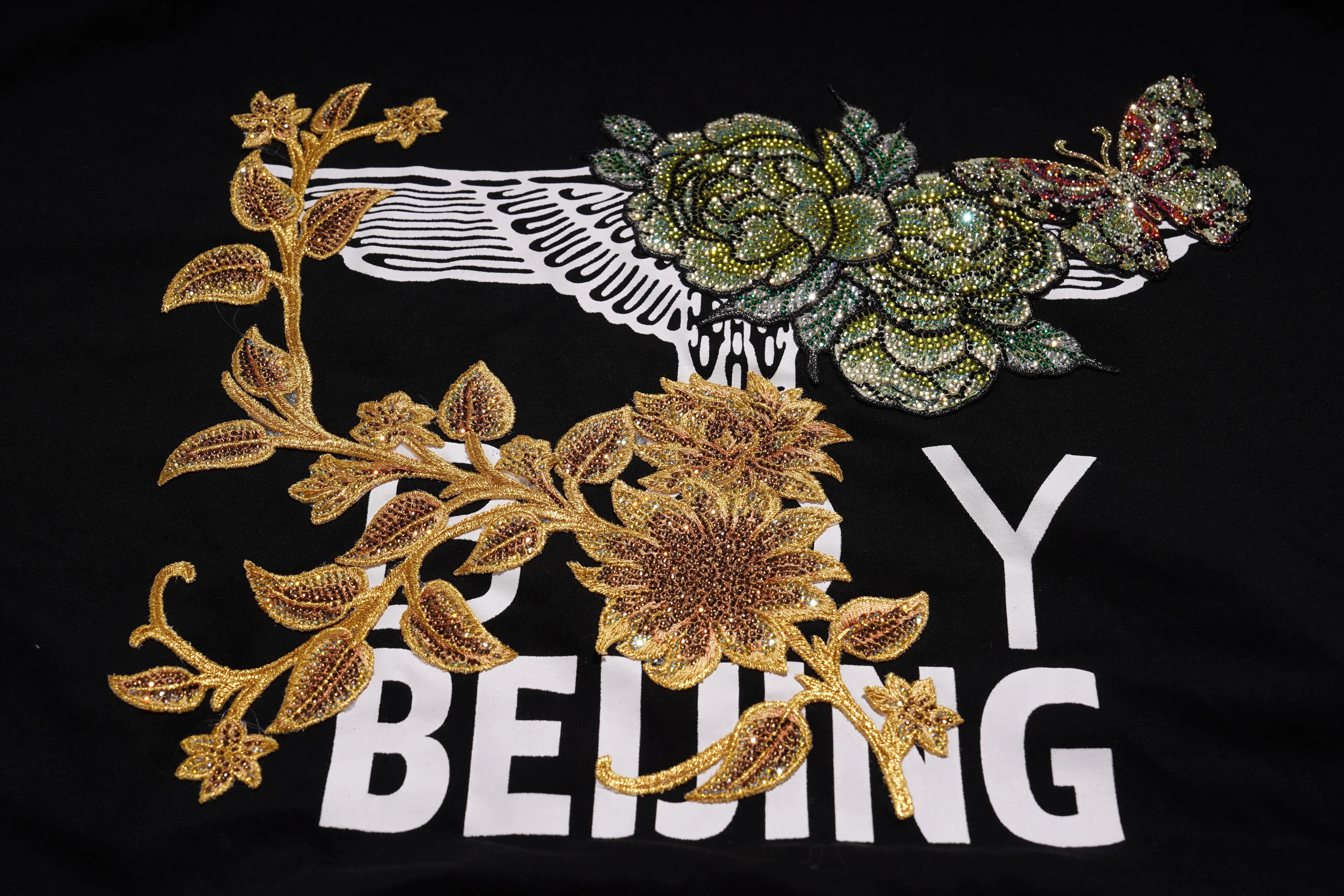 Decorative patch with floral designs and 'Enjoy Beijing' text on a black background, TCH Embroidered Floral Butterfly Rhinestone T-Shirt