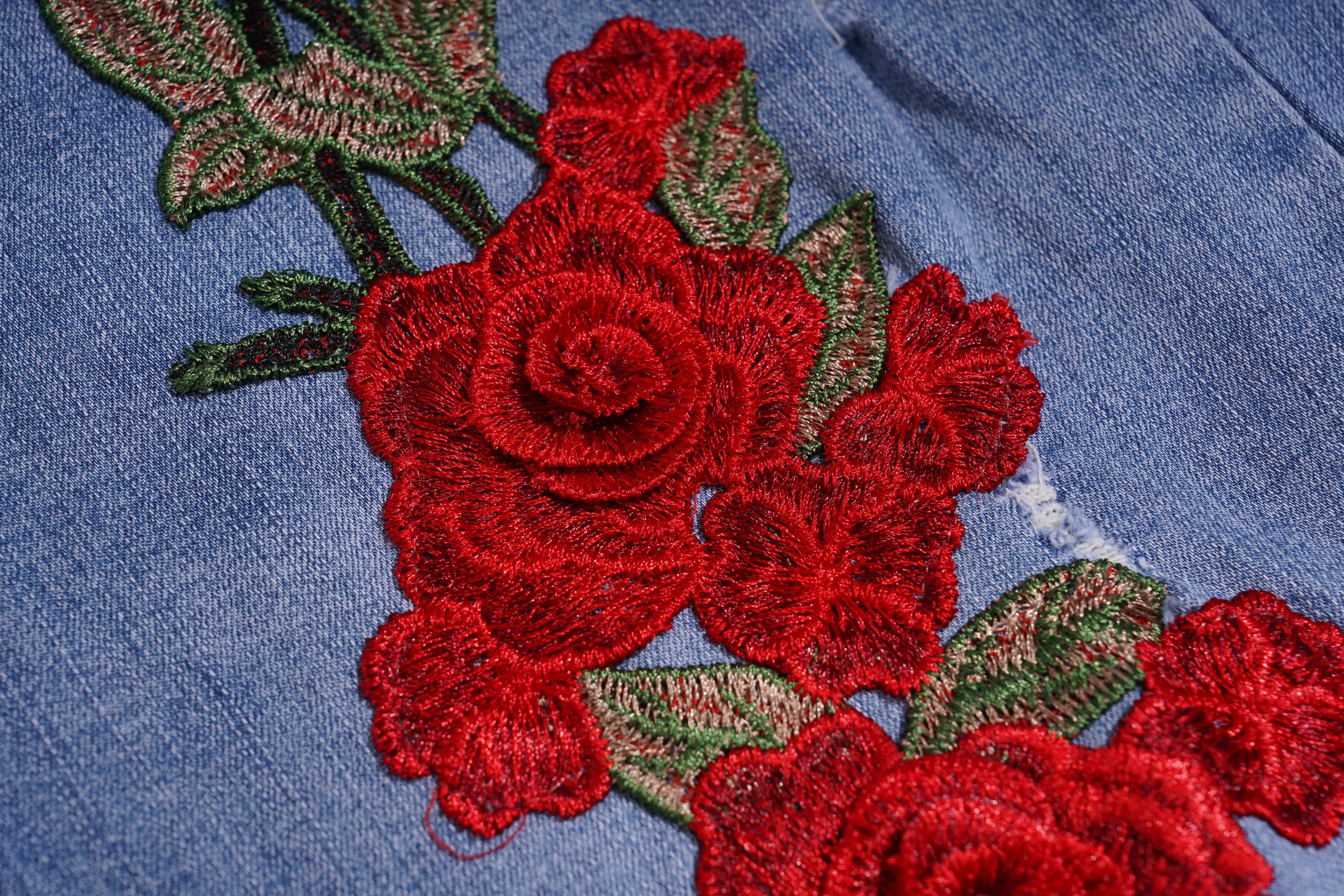 Embroidered red roses on a blue fabric background, TCH Embroidered Rose & Rhinestone Butterfly Denim Jeans
