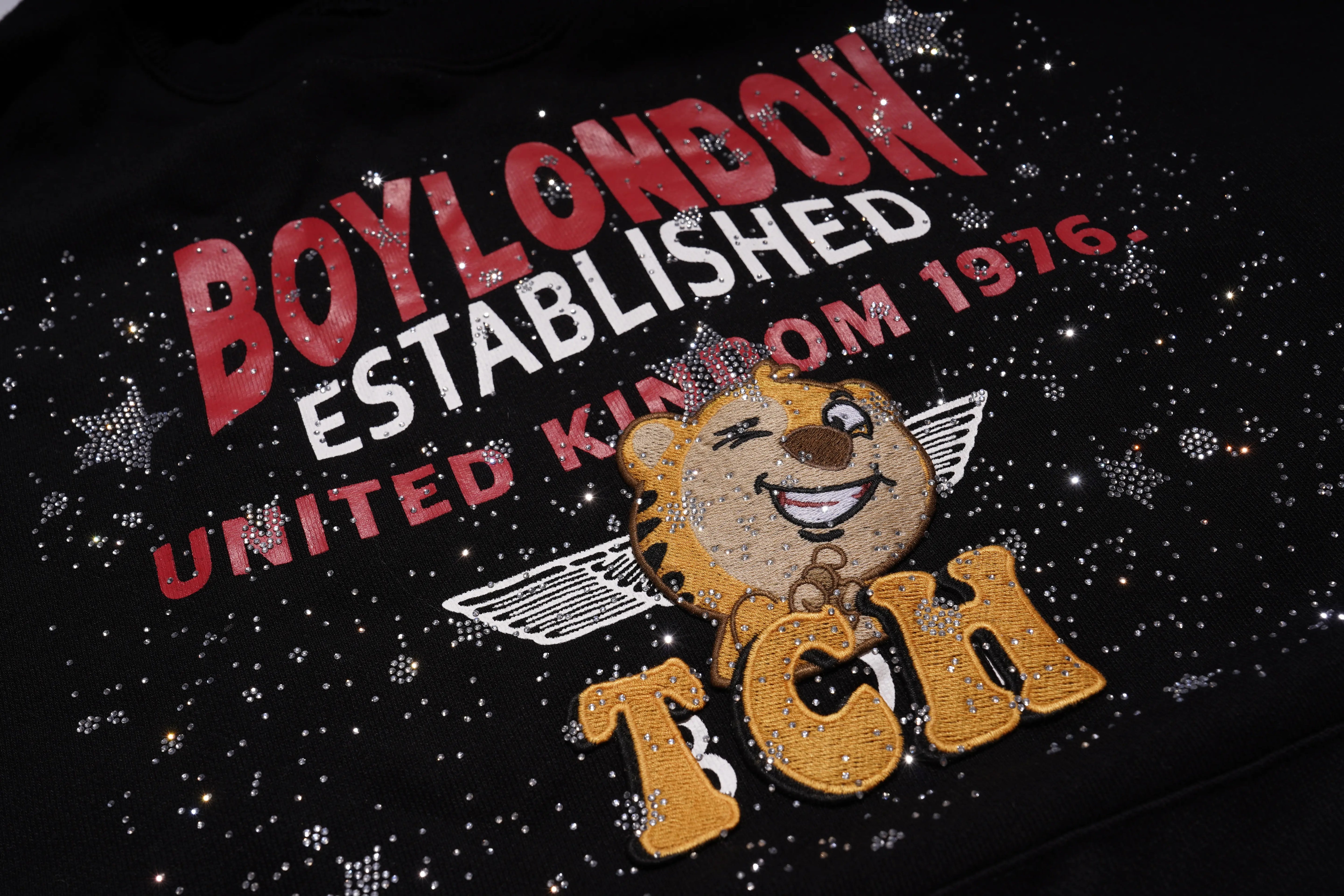 Black shirt with 'Boy London' text and lion logo, TCH Embroidered TCHUCM Rhinestone Hoodie