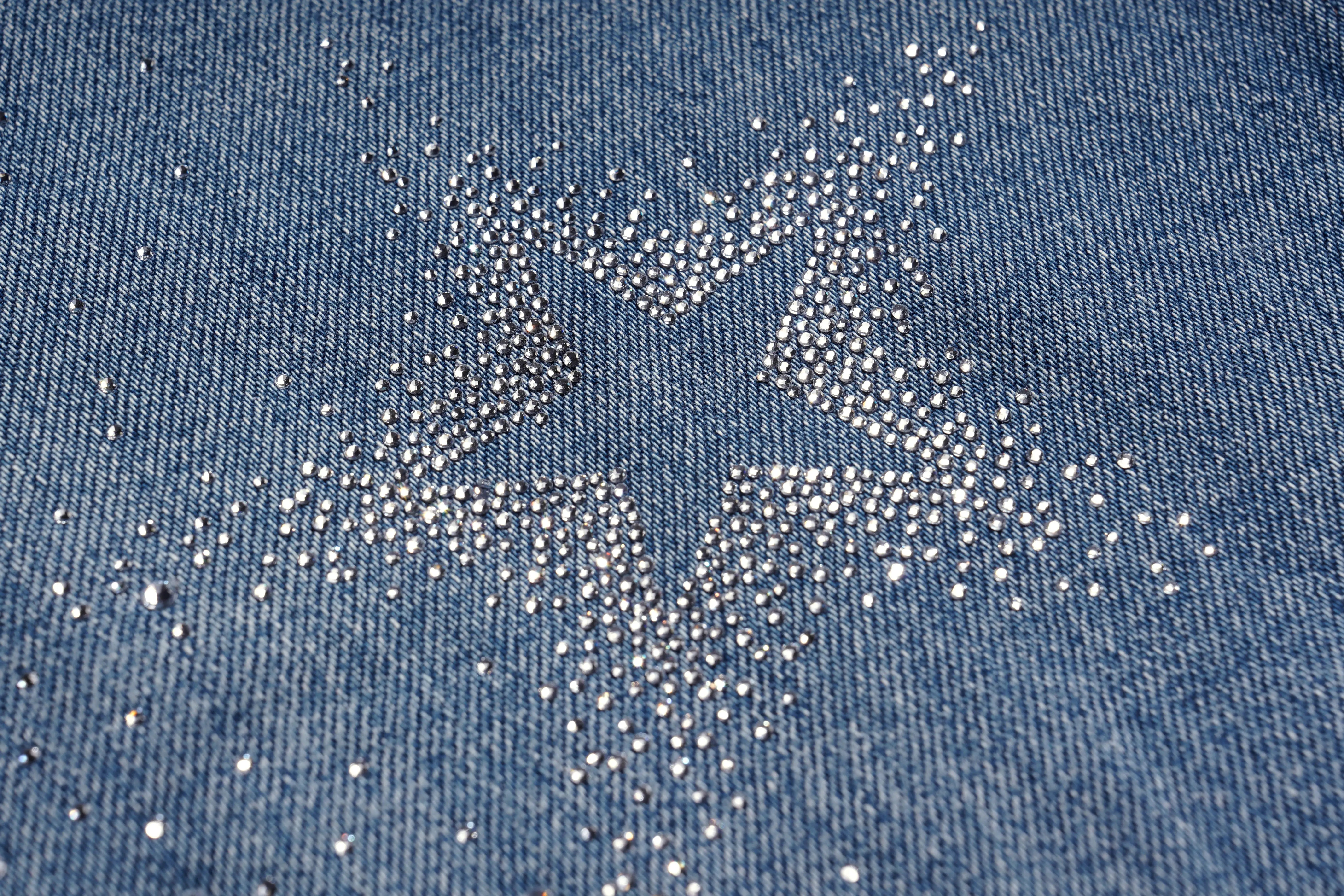Close-up of blue denim fabric with rhinestone pattern, TCH Firework Star Rhinestone Straight-Leg Blue Jeans