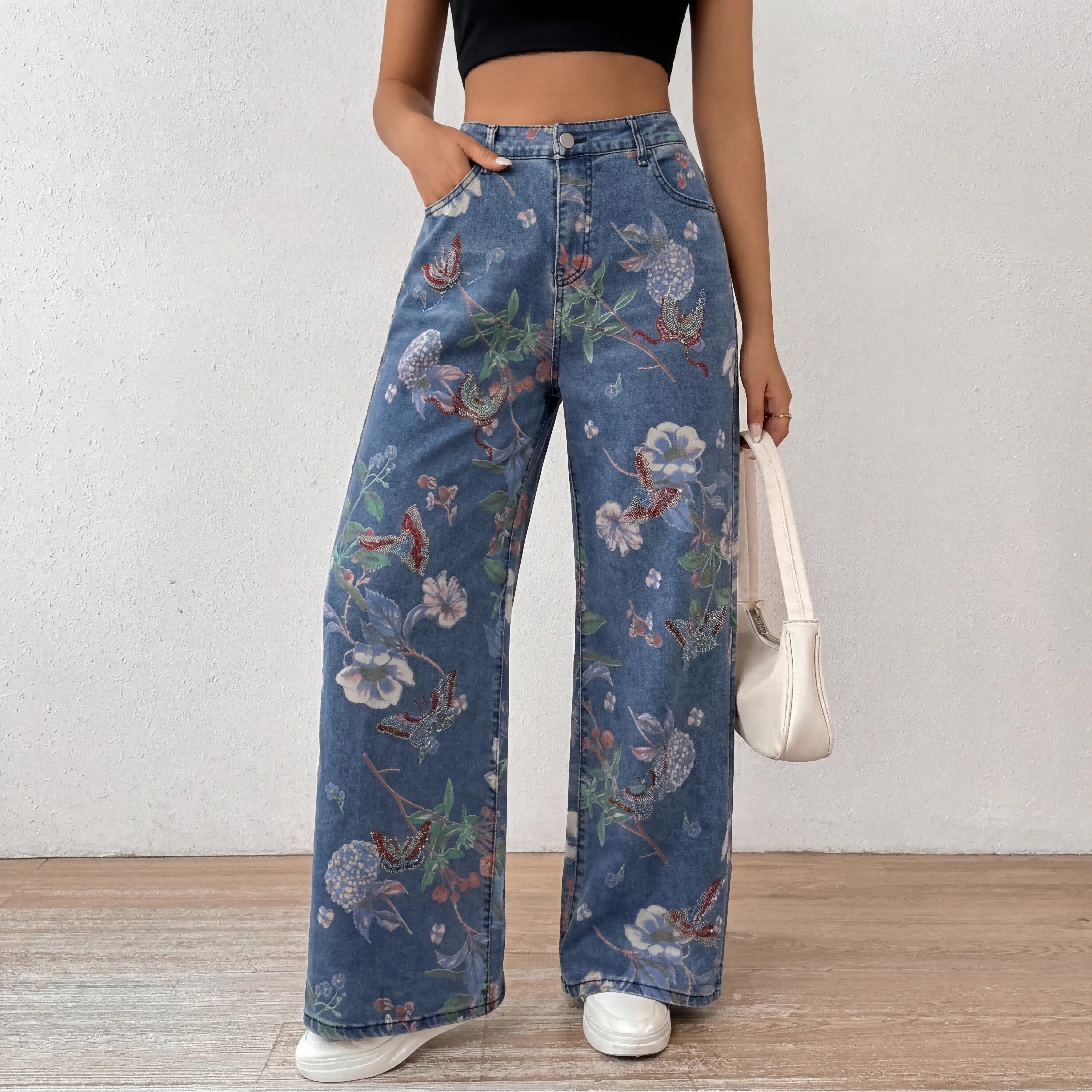 Person wearing floral embroidered jeans against a plain background, TCH Floral Print Rhinestone Butterfly Denim Jeans