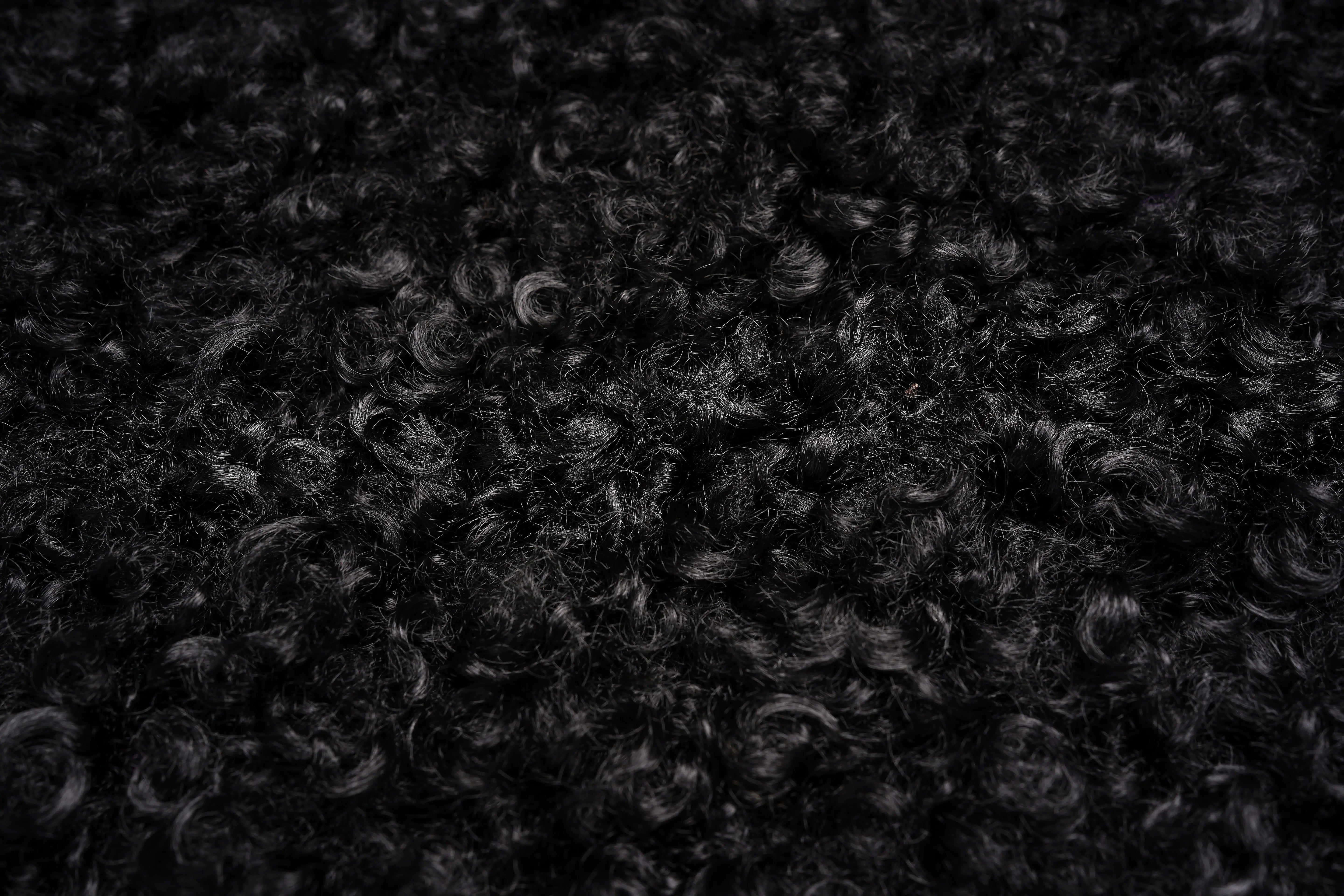 Close-up of black textured fabric, TCH Fuzzy Rhinestone Wings High-Neck Zip Sleeveless Vest