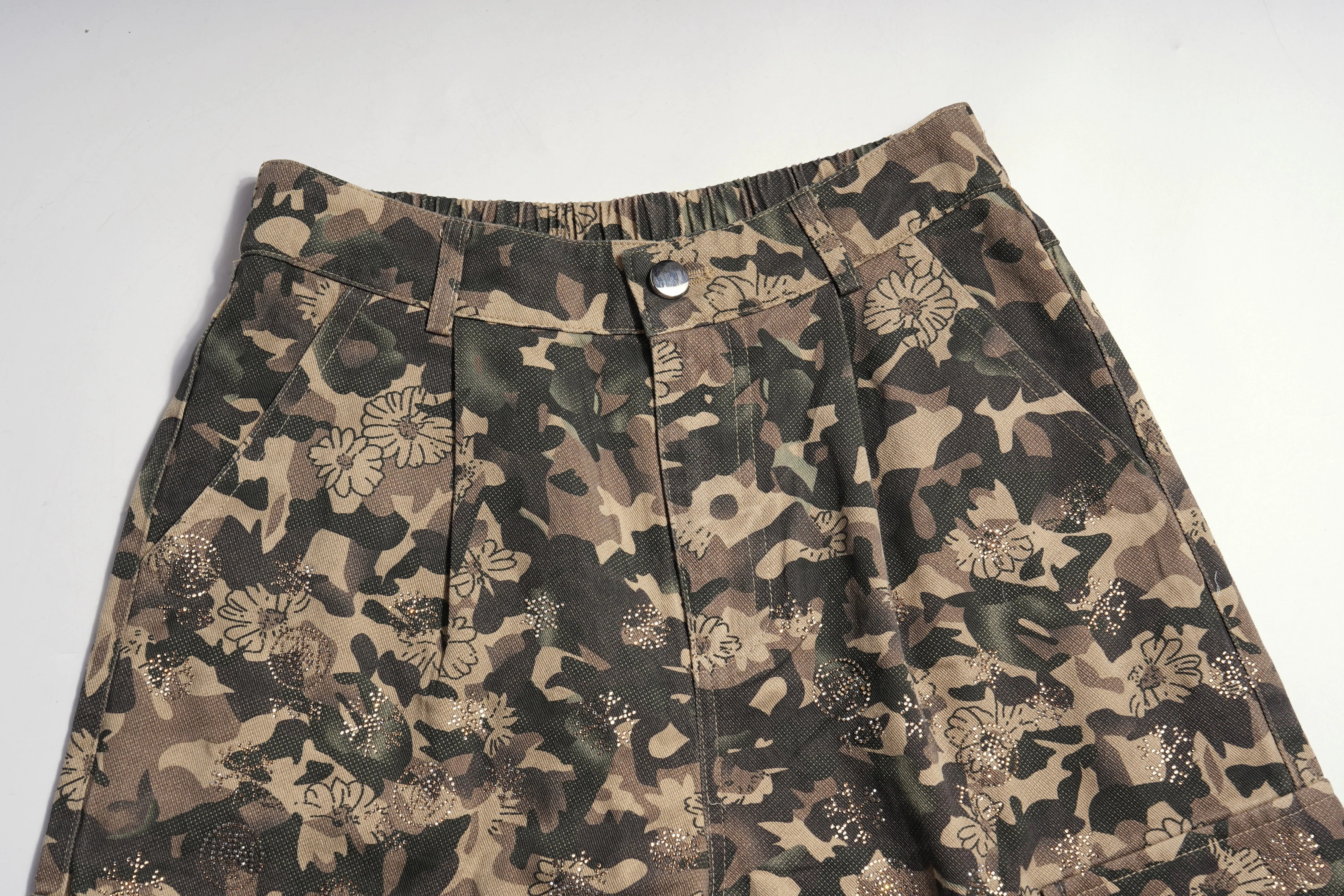 Camouflage-patterned skirt on a white background, TCH Gold Snowflake Rhinestone Camo Denim Jeans