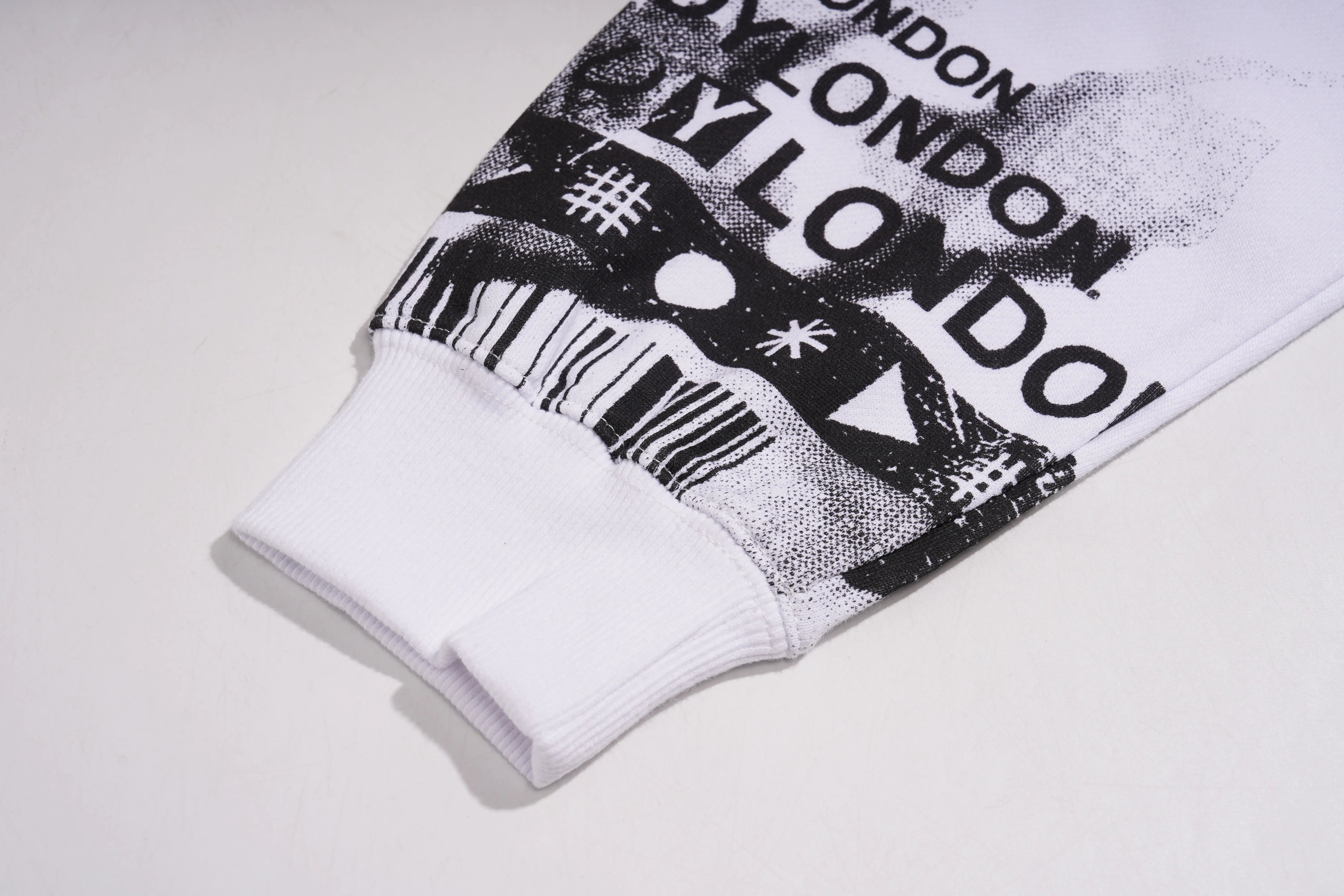 White sock with black text and graphics on a light gray background, TCH Graffiti Logo Print Crewneck Sweatshirt
