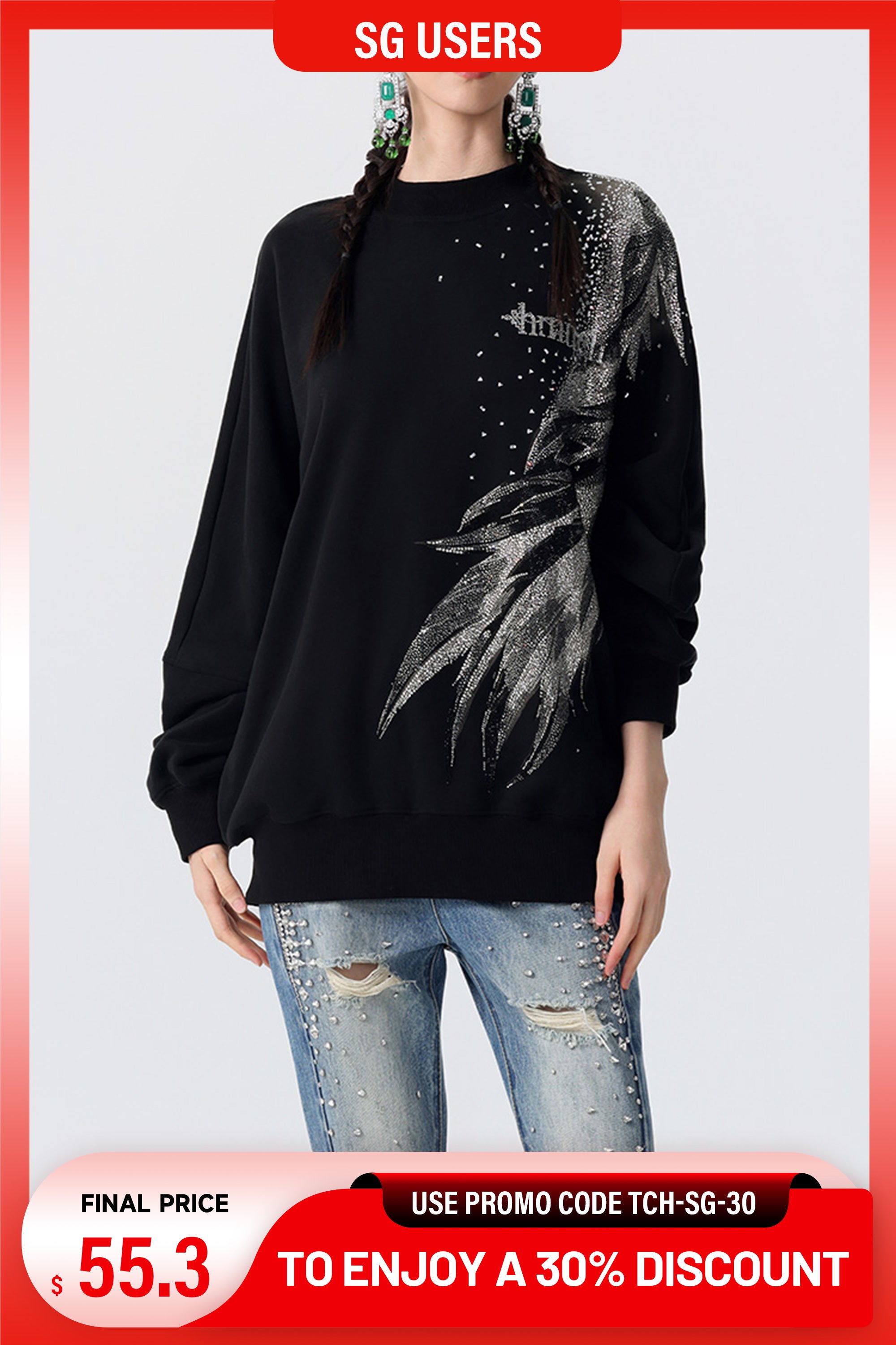 Person wearing a black sweater with a floral design and ripped jeans on a white background. TCH Graphic Rhinestone Style Letter Sweatshirt