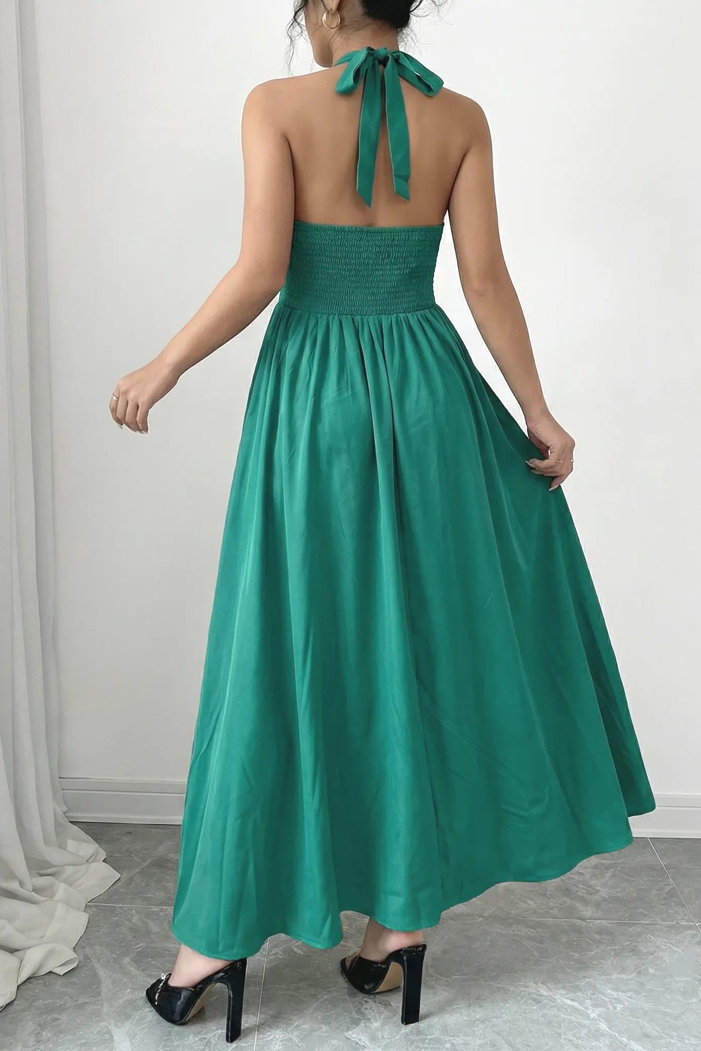 Woman wearing a green halter neck dress with a plain background, TCH Green Rhinestone Teddy Laundry Story Dress