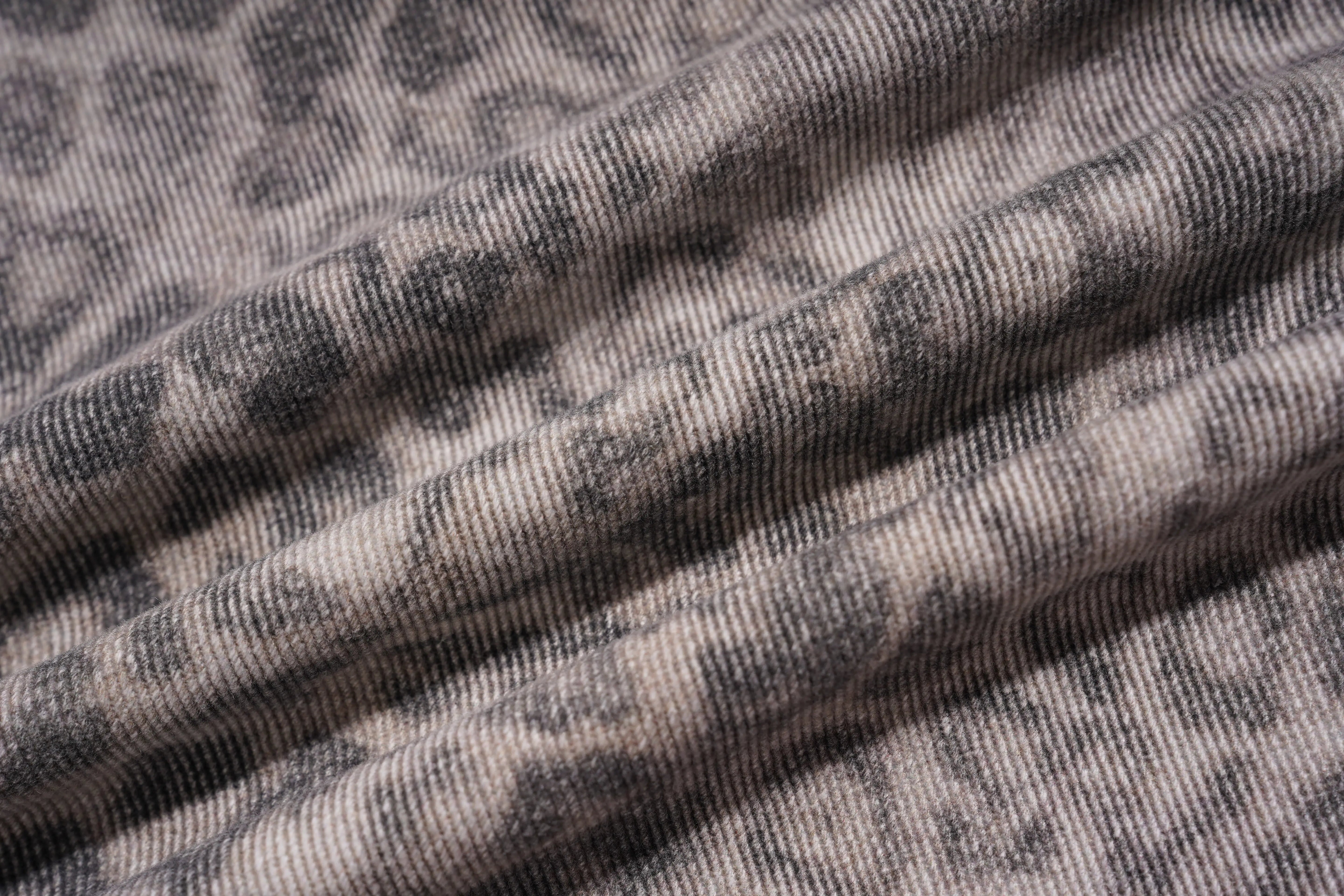 Close-up of gray fabric with a subtle pattern, TCH Grey Leopard Rhinestone Wings Wide-Leg Jeans