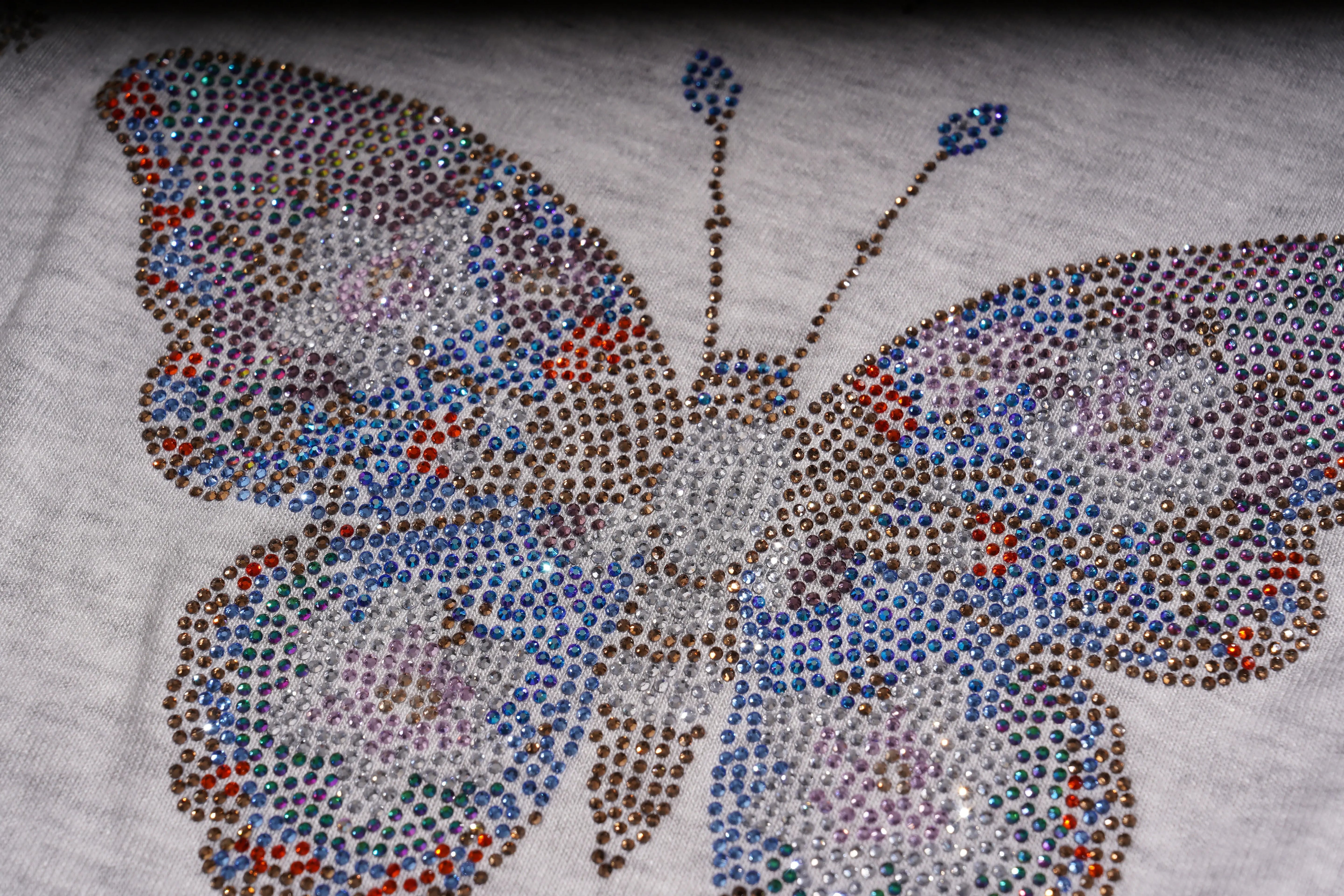 Butterfly design made with colorful rhinestones on a light fabric background, TCH Grey Rhinestone Butterfly Pajama Set
