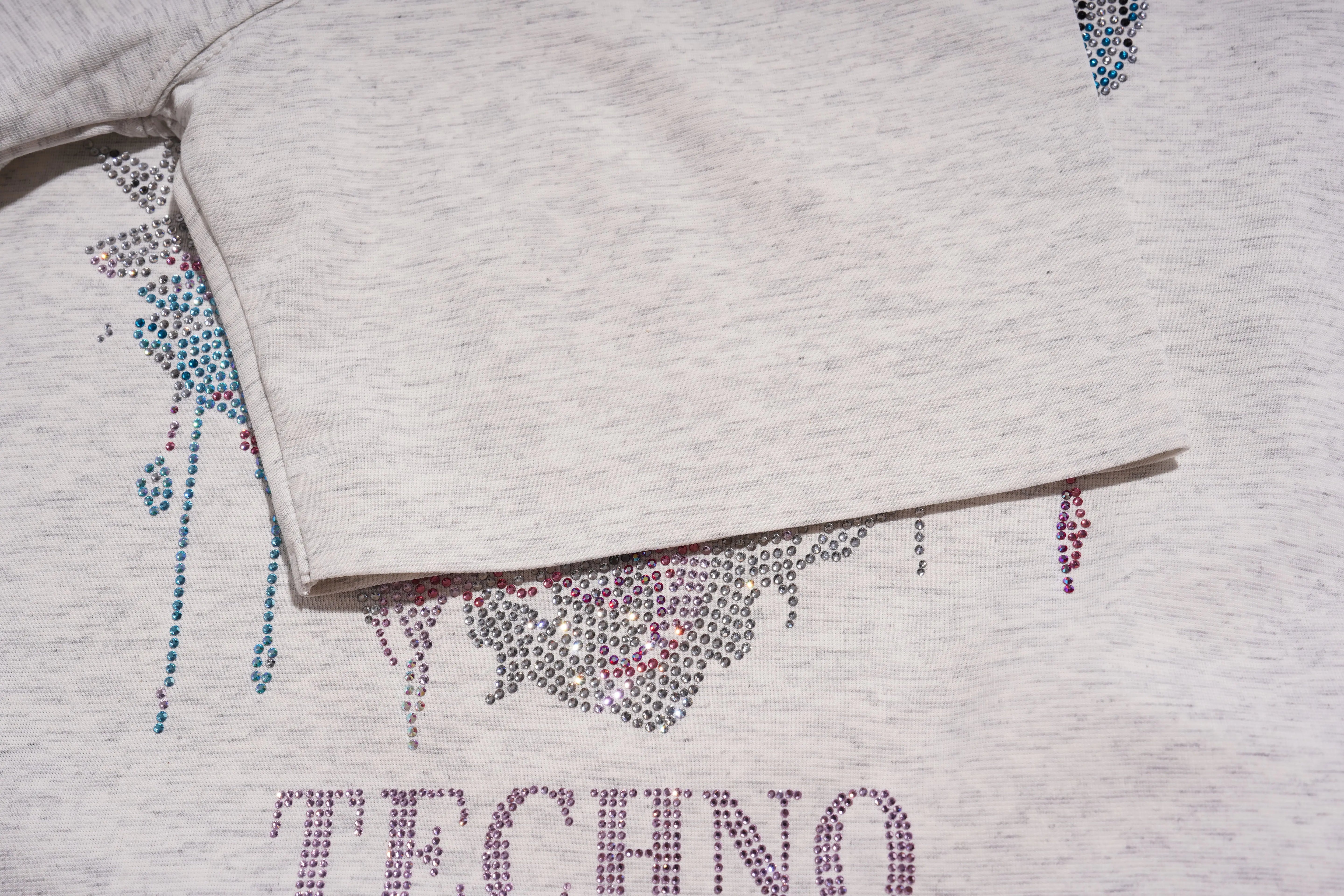 Gray sweatshirt with 'TECHNO' text and rhinestone embellishments on a light gray background, TCH Grey Rhinestone Unicorn Graphic T-Shirt