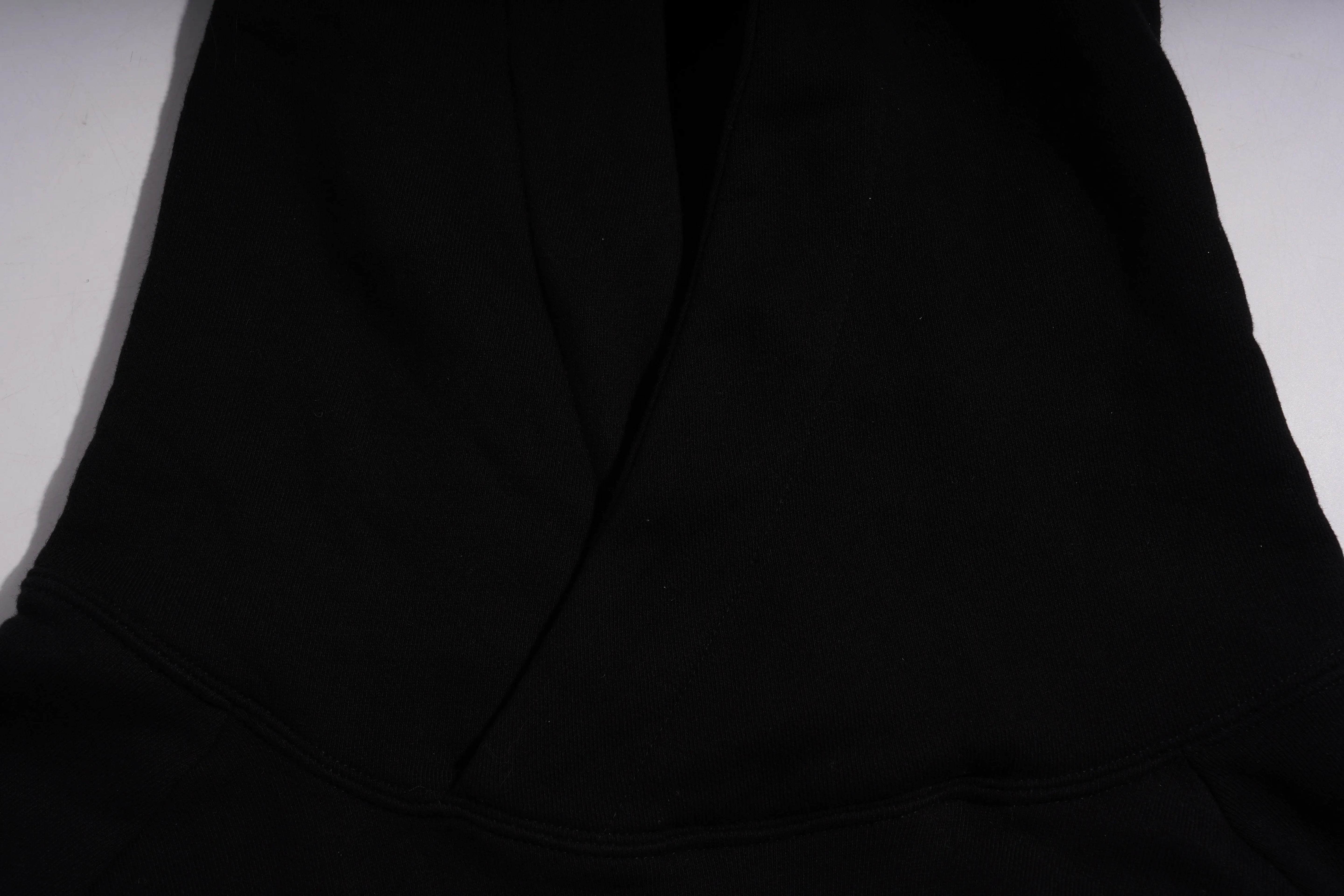 Close-up of a black fabric texture, TCH Luck Dog Rhinestone Hooded Sweatshirt