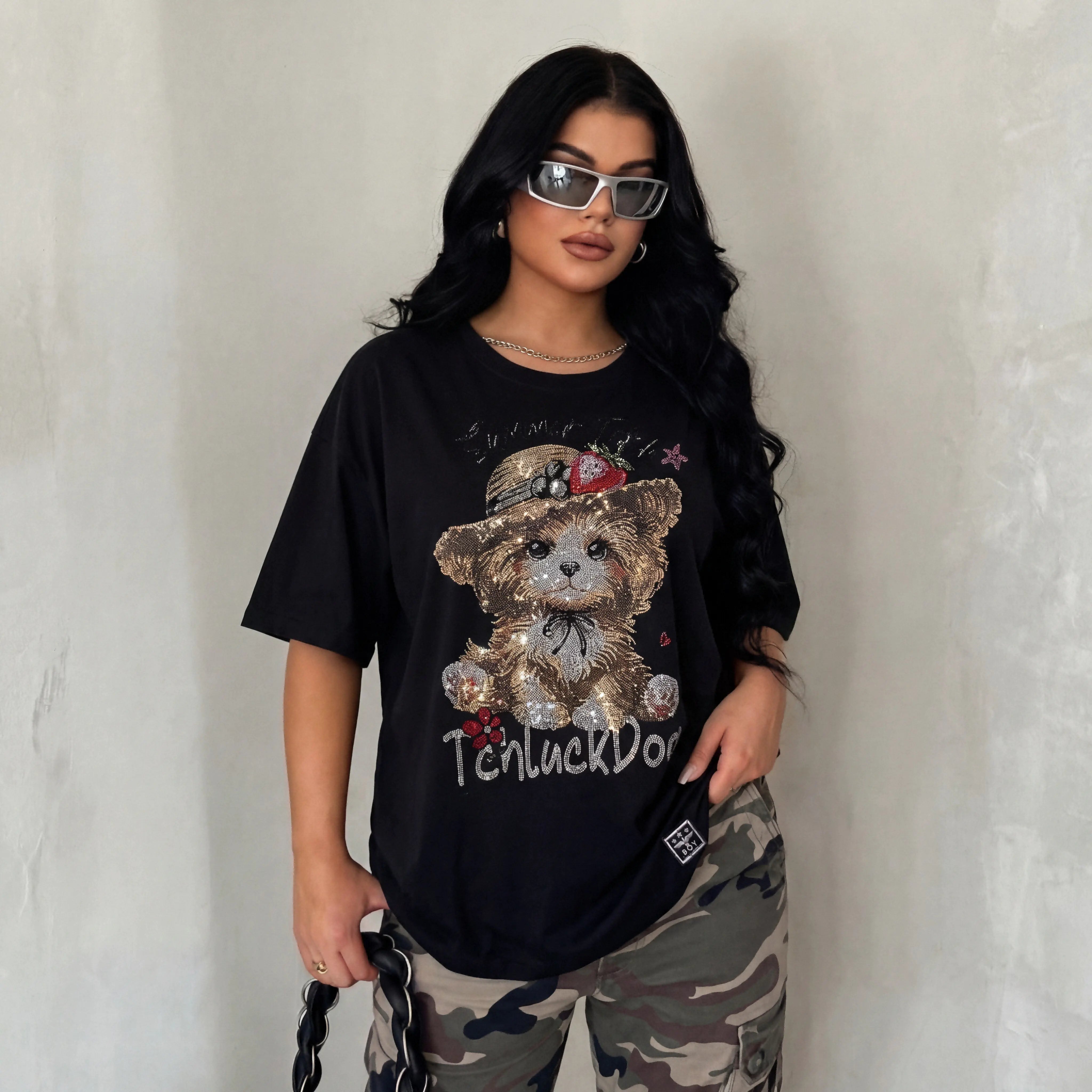 Person wearing a black t-shirt with a teddy bear graphic and camouflage pants against a plain background, TCH Luck Dog Rhinestone T-Shirt