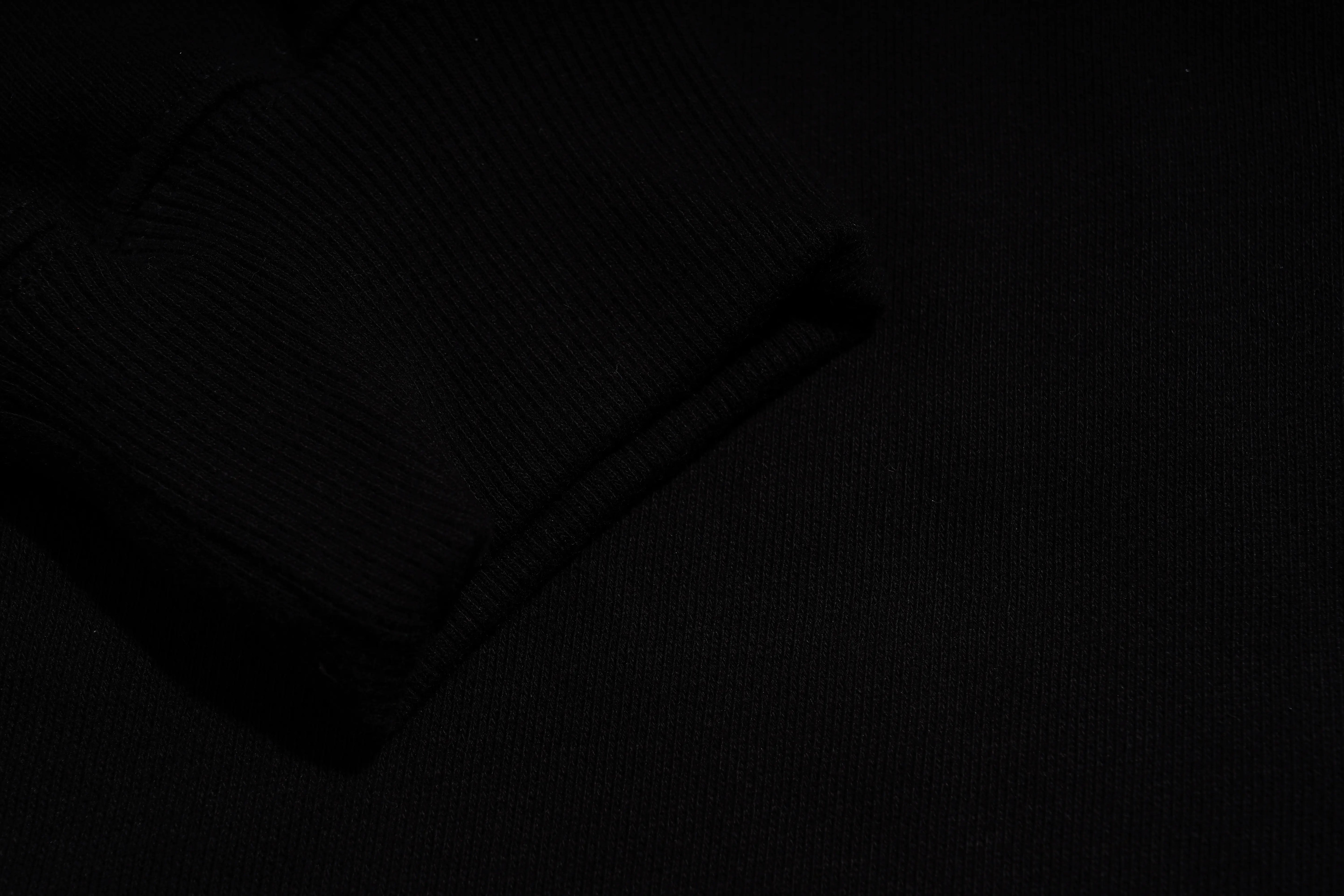 Dark textured background with a long, thin object resembling a pen or tool. TCH Lucky Pig Rhinestone Sweatshirt