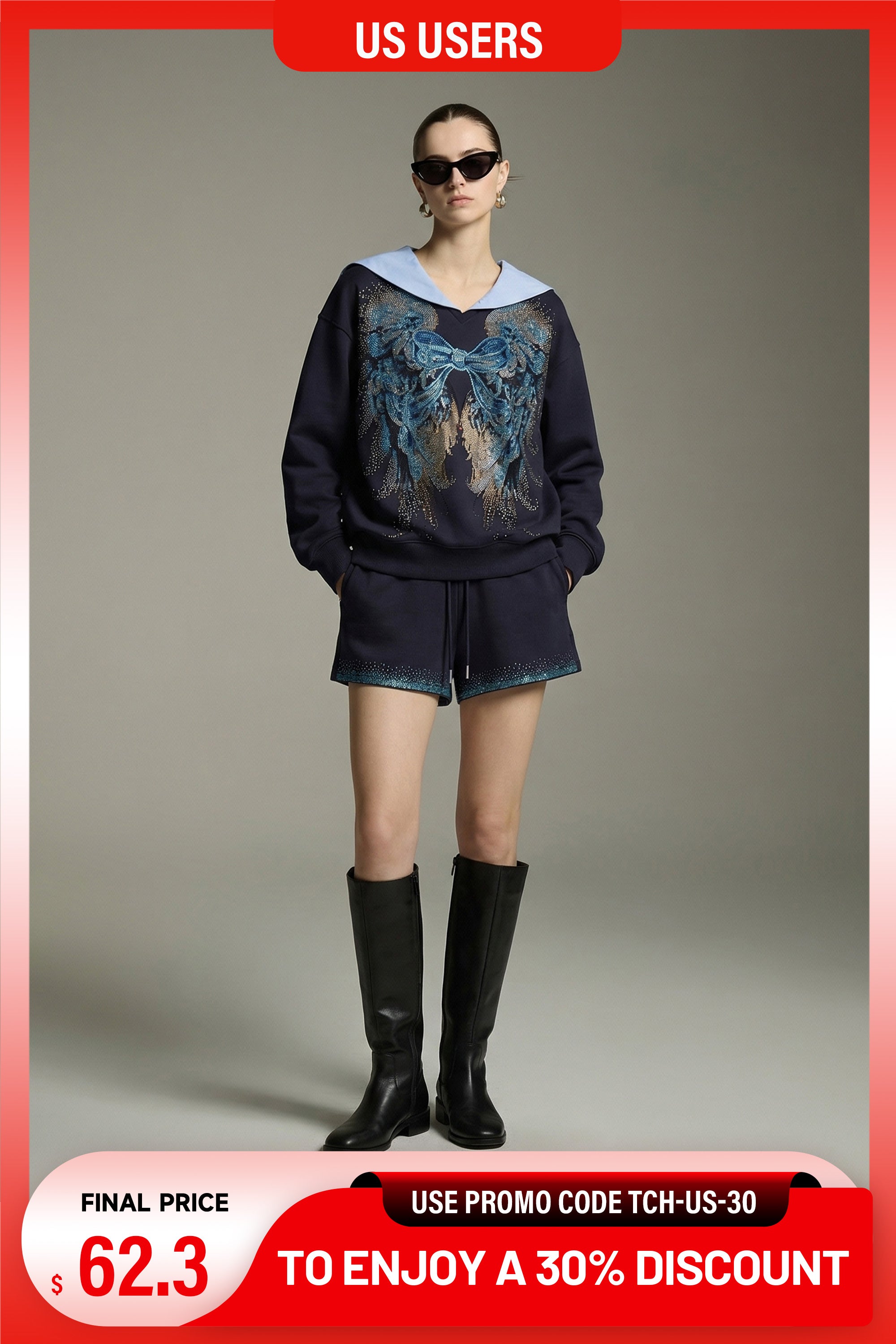 Model wearing a dark blue outfit with a graphic design, standing against a plain background. TCH Navy Sailor Bow Wings Rhinestone Two-Piece Set