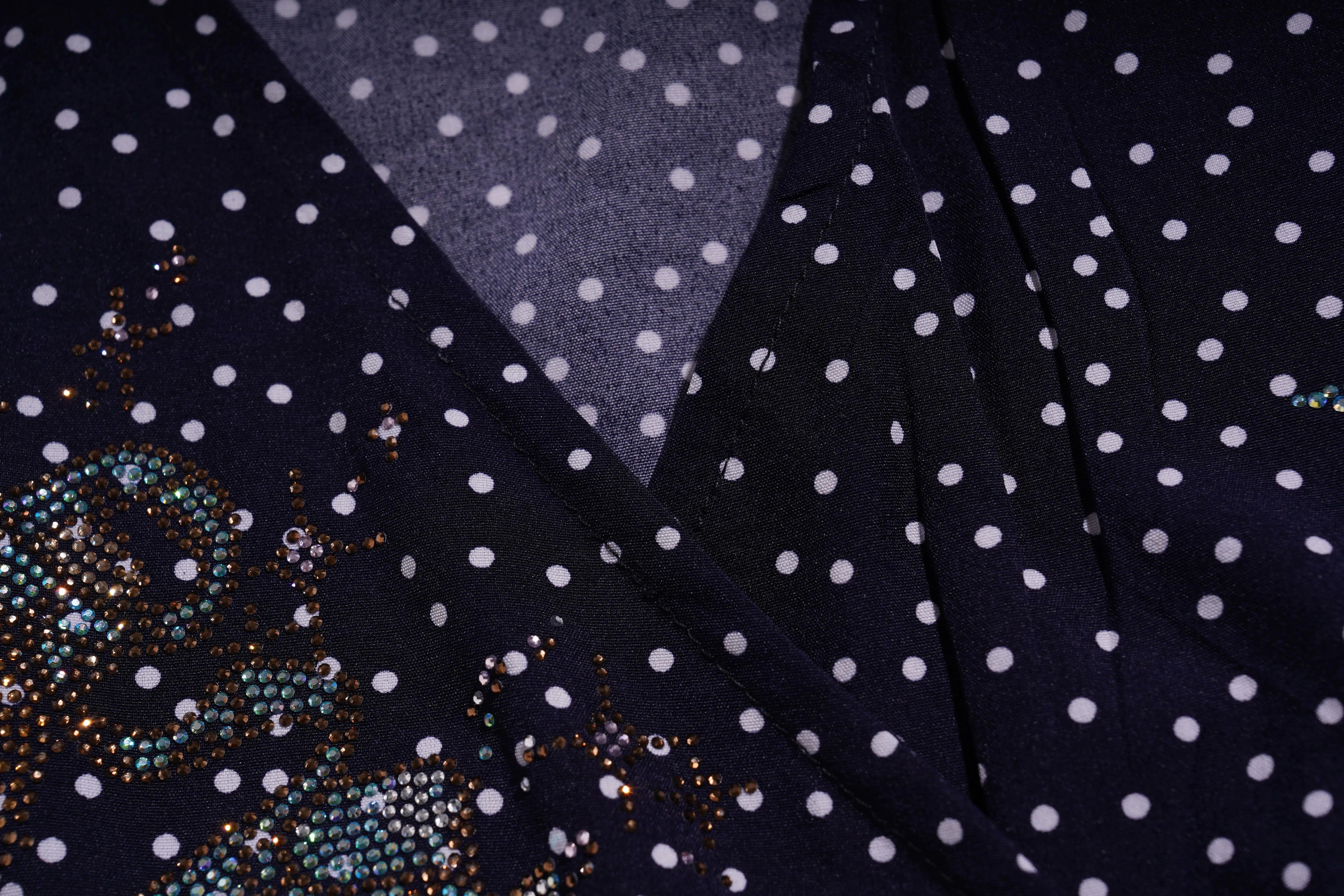 Navy blue fabric with white polka dots and decorative elements. TCH Navy Teddy Bear Bow Rhinestone Dress