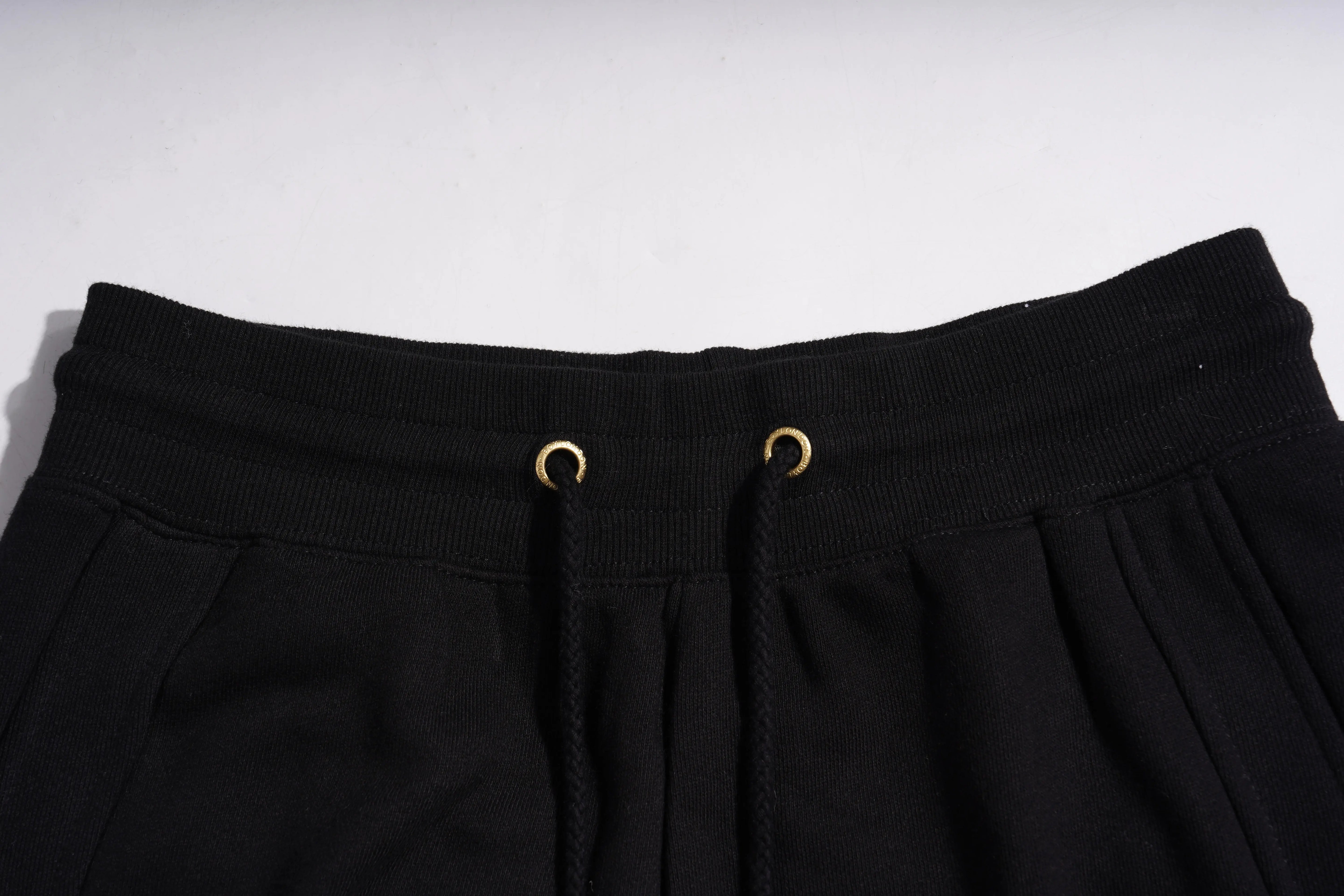 Close-up of black pants with a white background, TCH Panda Rhinestone Black Jogger Pants