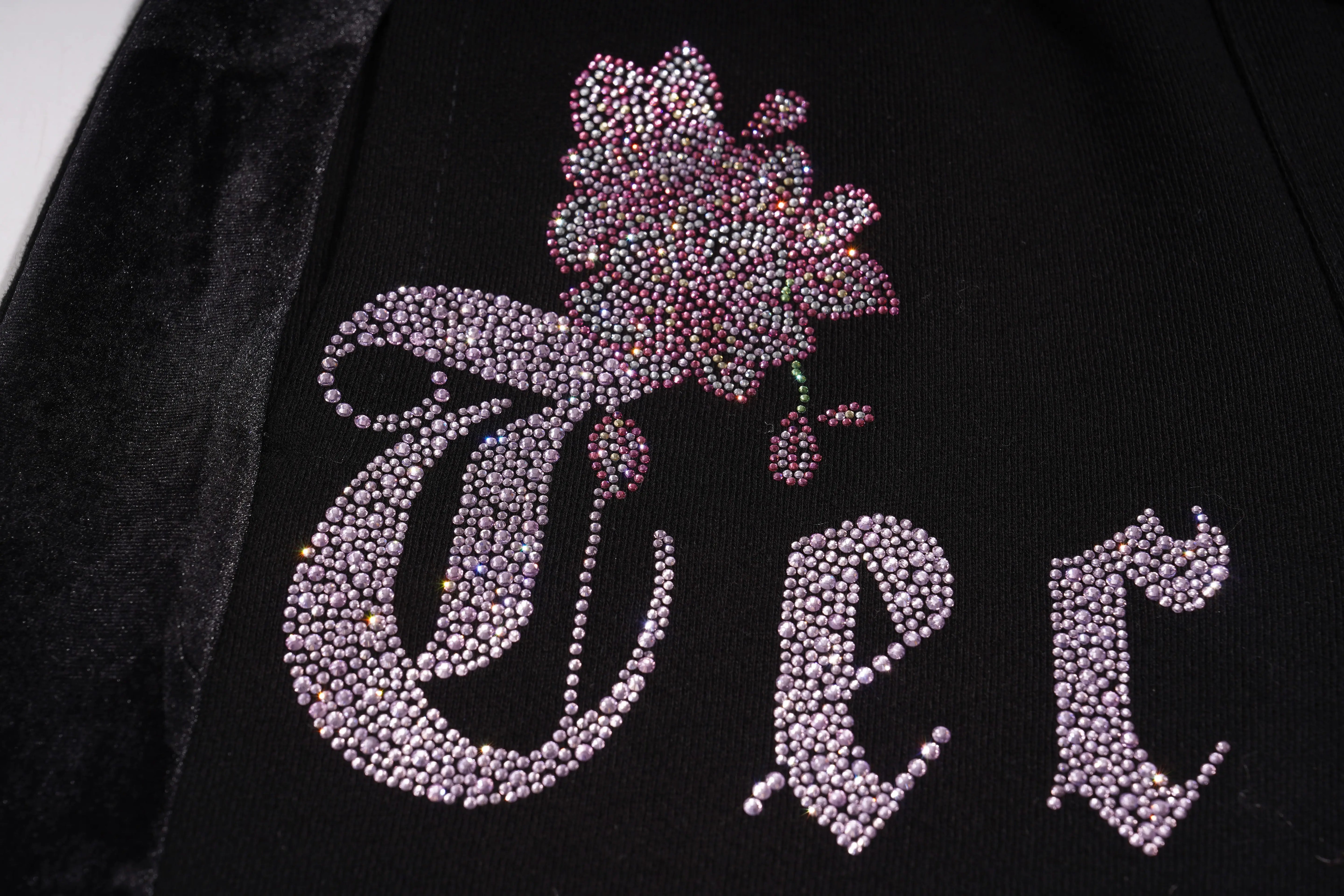 Decorative design with 'Vee' and floral elements on a black background, TCH Pink Blossom Rhinestone Jogger Pants