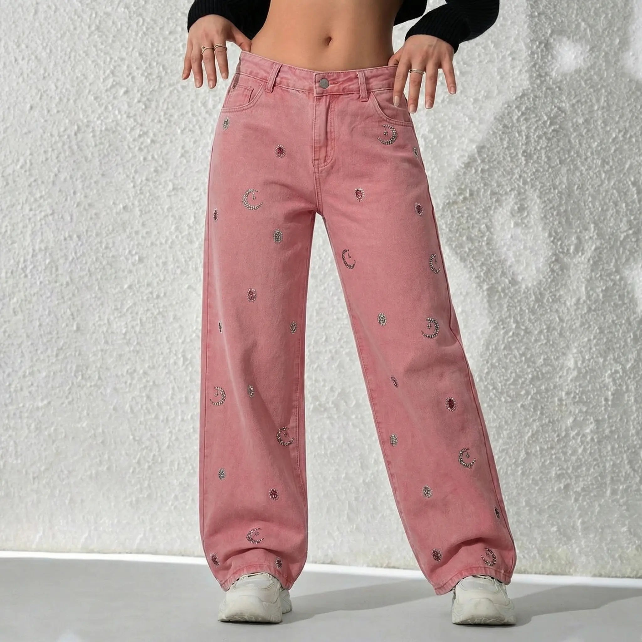 Pink jeans with embroidered patterns worn by a person on a light gray background, TCH Pink Moonlight Rhinestone Denim Jeans