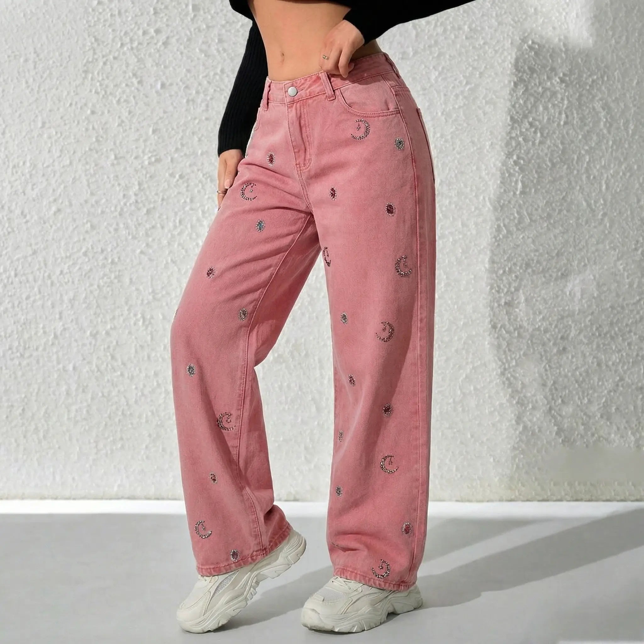Person wearing pink jeans with embroidered details against a white background, TCH Pink Moonlight Rhinestone Denim Jeans