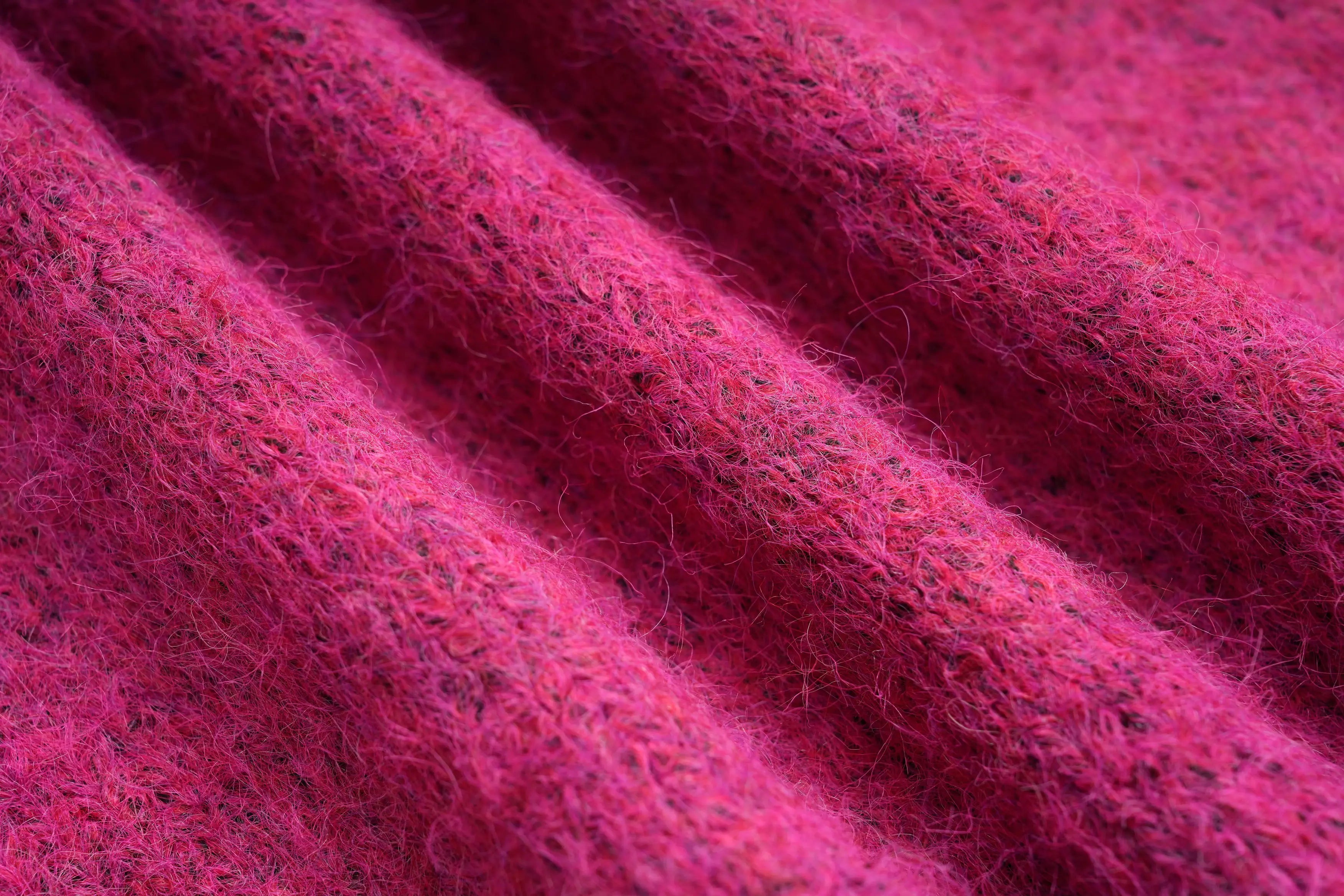 Close-up of pink fabric with a textured pattern, TCH Pink Rhinestone Bear Knit Cardigan