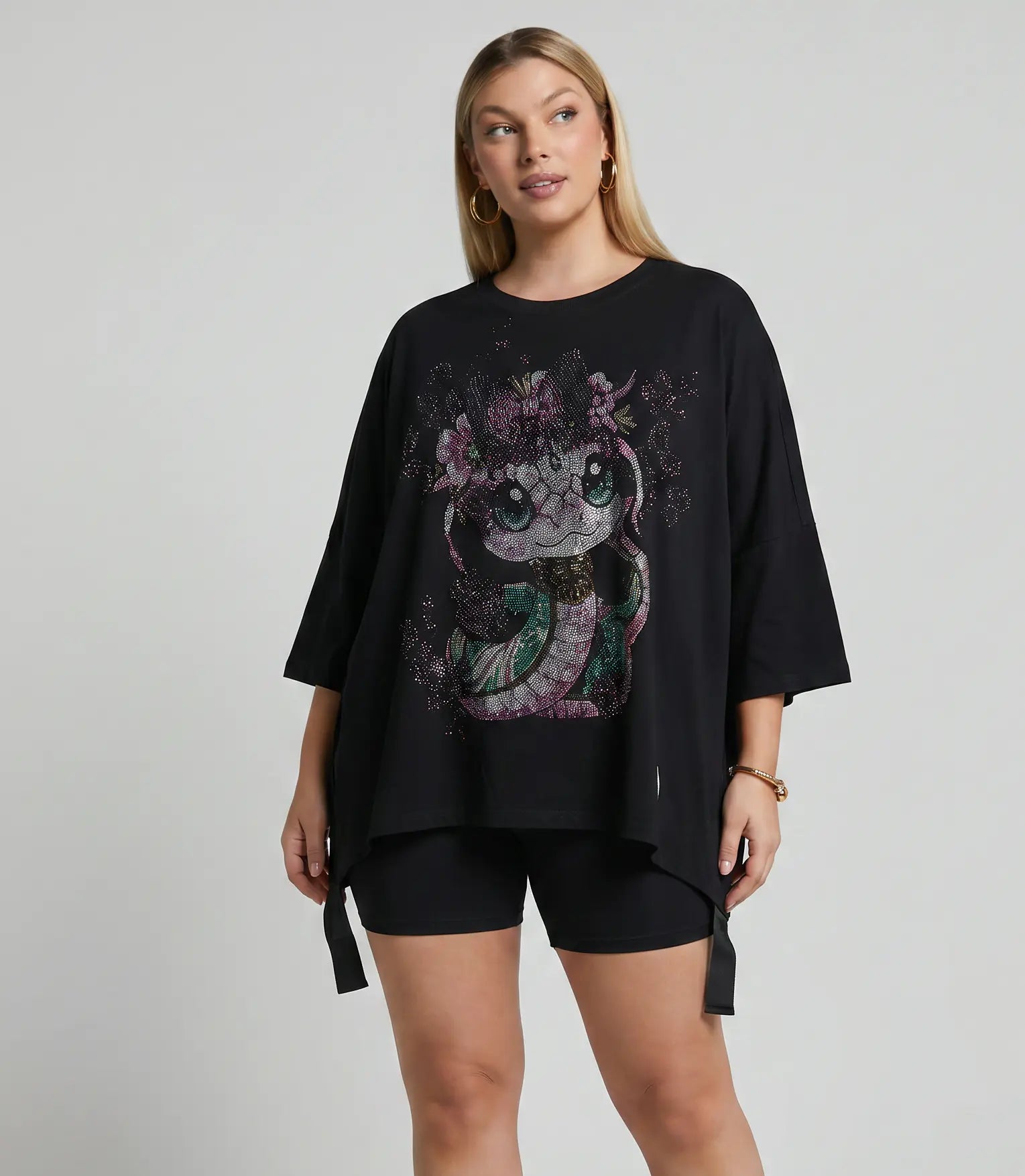 Woman wearing a black oversized t-shirt with a graphic design on a plain background, TCH Pink Snake Rhinestone Oversize T-Shirt