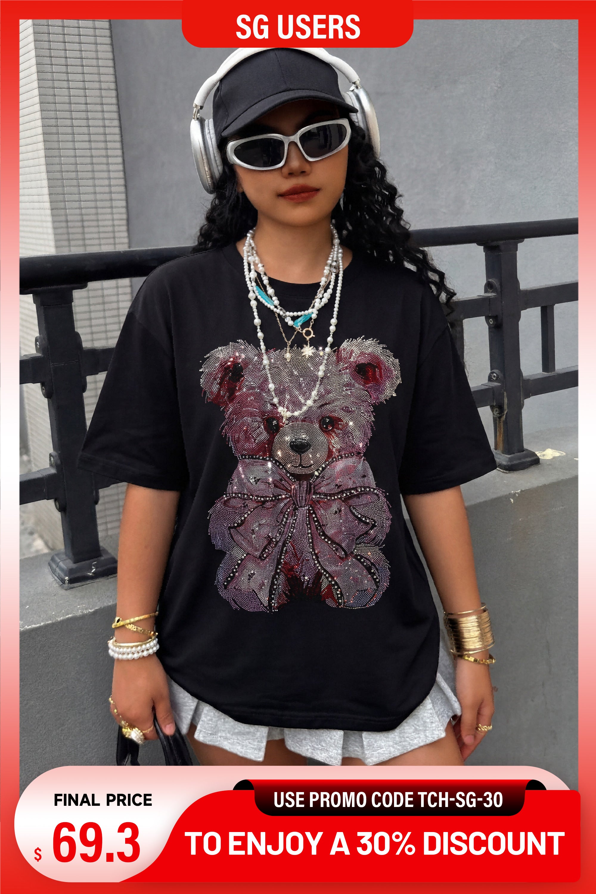 Person wearing a black t-shirt with a bear graphic and accessories, standing outdoors. TCH Pink Teddy Bear Rhinestone T-Shirt