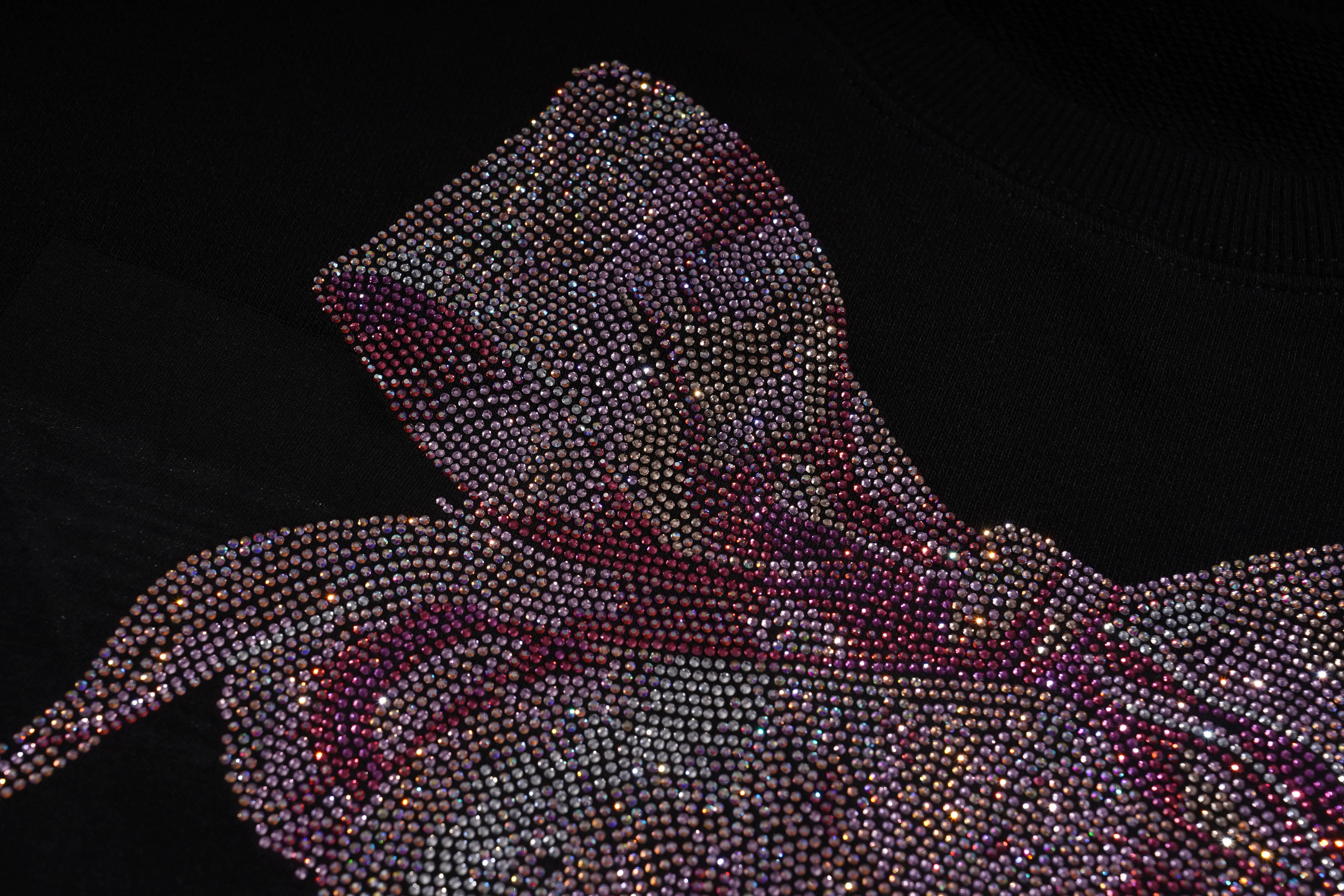 Close-up of a hooded garment made from small, shiny beads against a black background, TCH Pink Teddy Rhinestone Sweatshirt