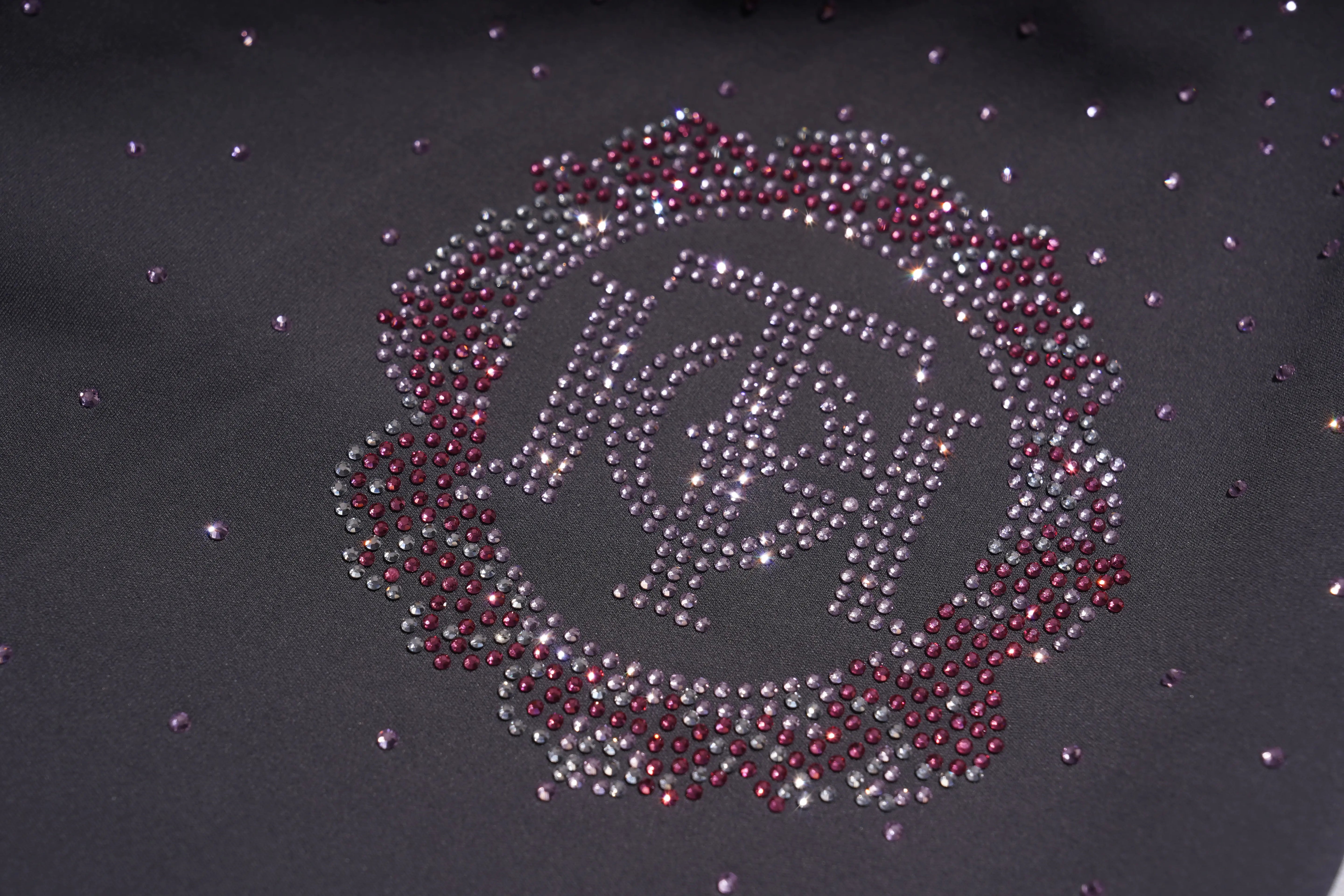 Decorative design made of rhinestones on a dark fabric background, TCH Purple Rhinestone Gradient Sweatpants