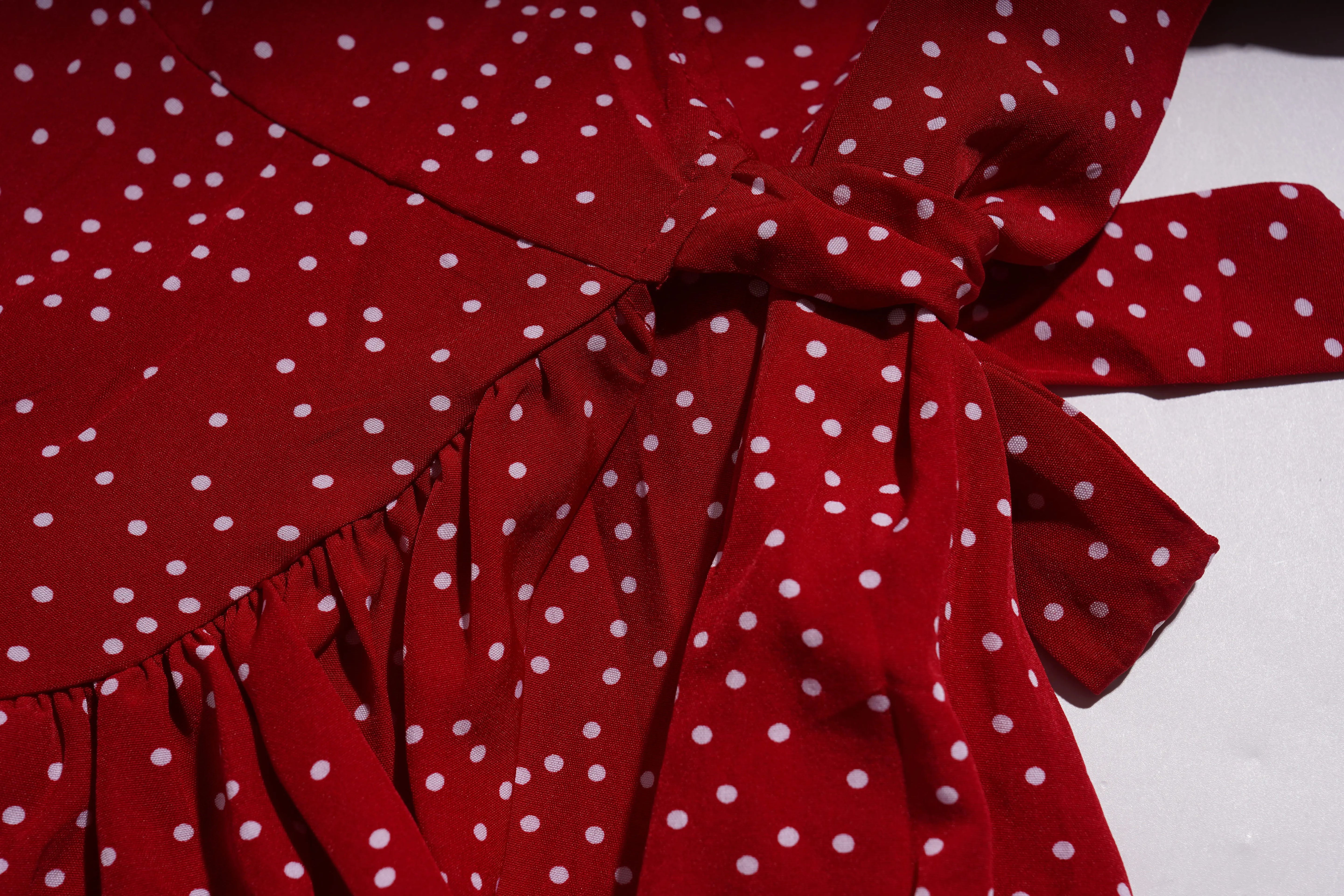Red polka dot dress with a large bow on a white background, TCH Red Polka Dot Rhinestone Flower Dress