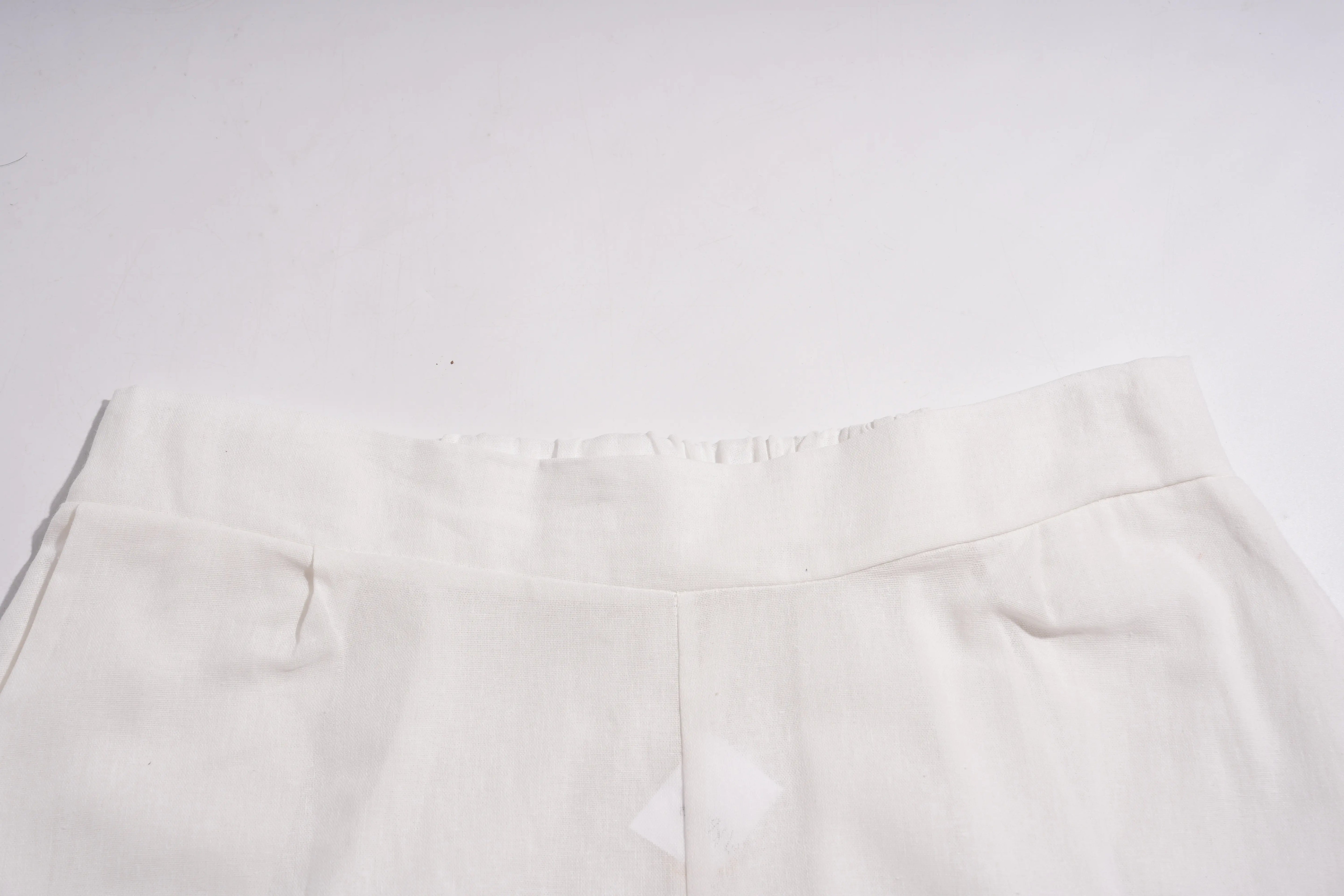 Close-up of a white fabric texture on a light gray background, TCH Rhinestone Angel Wings & Cross Set