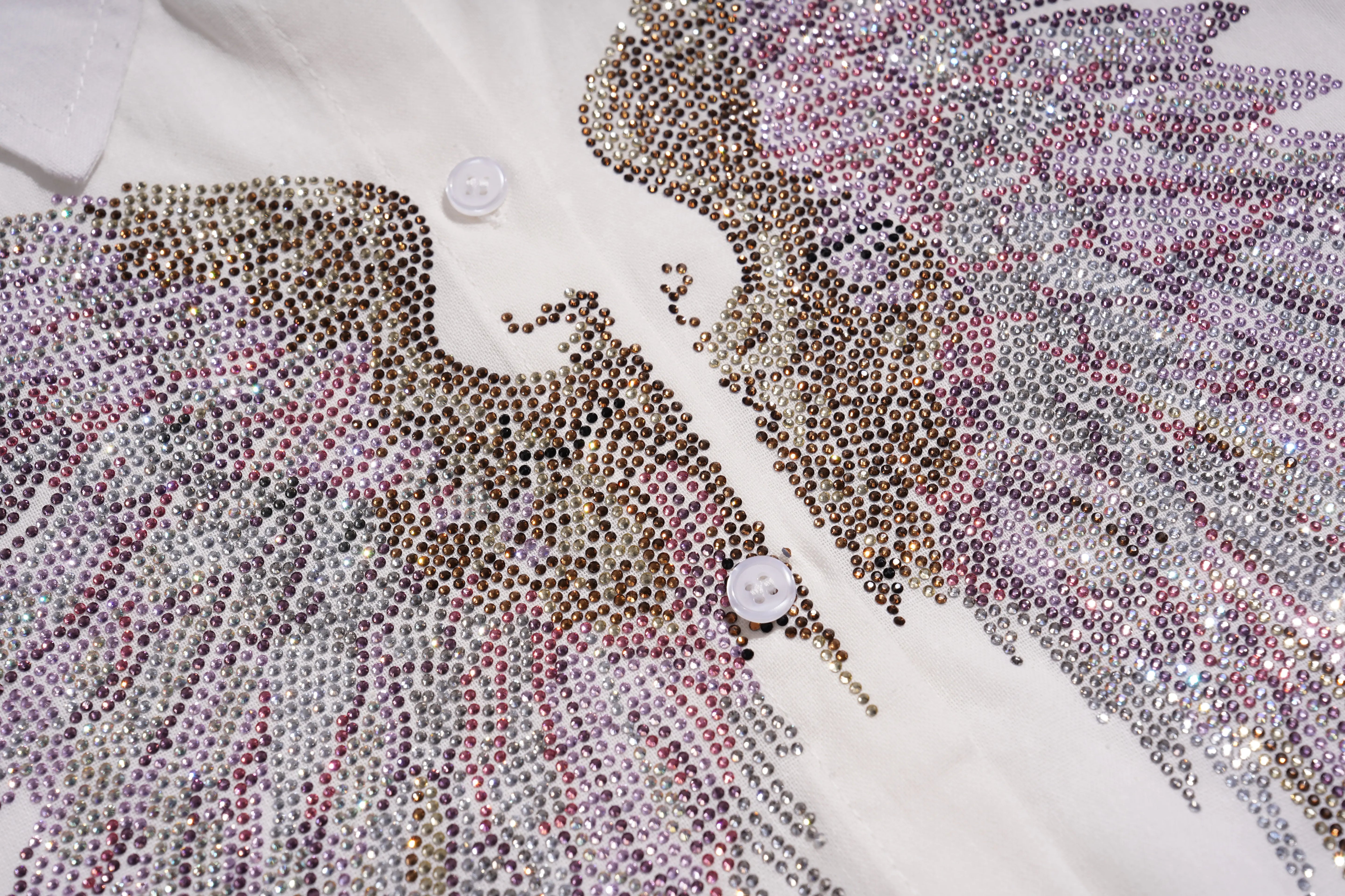 Close-up of a decorative shirt with rhinestone embellishments on a white background, TCH Rhinestone Angel Wings & Cross Set