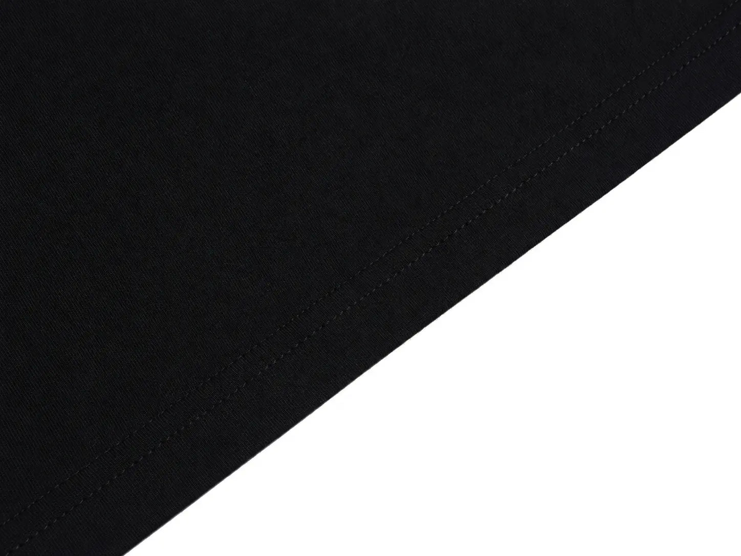 Close-up of a black fabric surface with a diagonal seam, shown against a white background. TCH Rhinestone Angel Wings Graphic T-Shirt