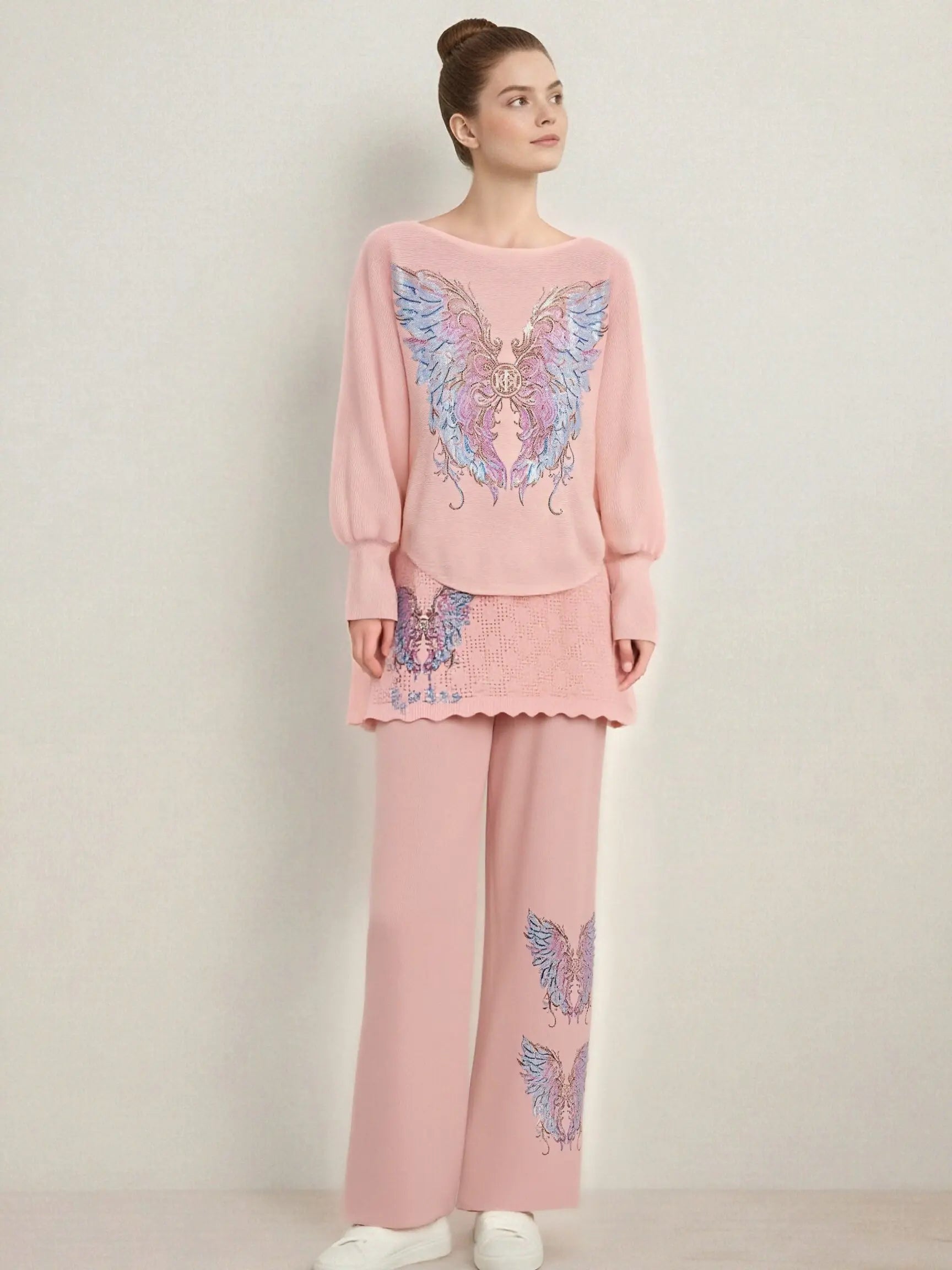 Woman wearing a pink outfit with butterfly designs on a plain background, TCH Rhinestone Angel Wings Layered Knit Top & Wide-Leg Pants Set