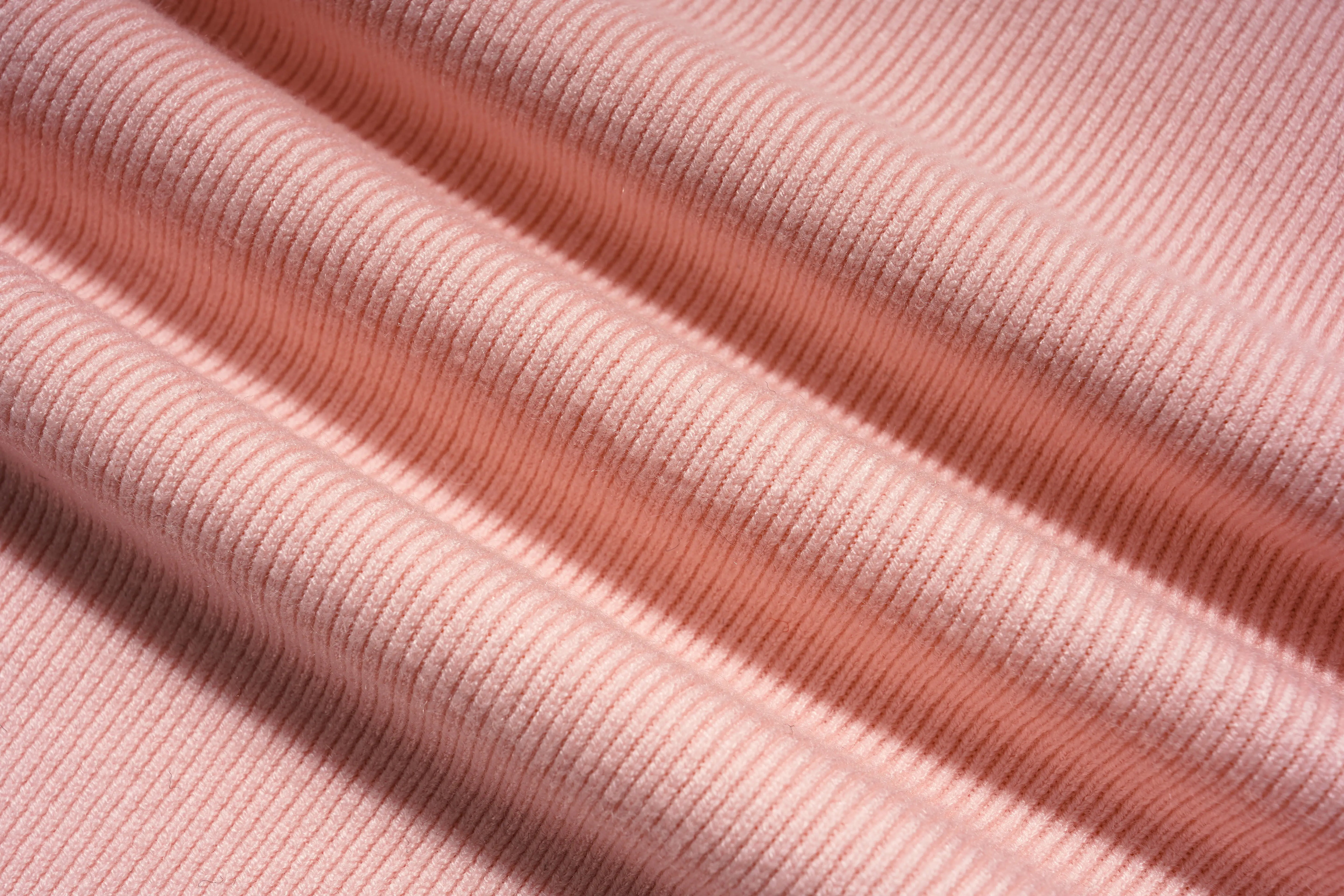 Close-up of pink ribbed fabric with shadows, TCH Rhinestone Angel Wings Layered Knit Top & Wide-Leg Pants Set