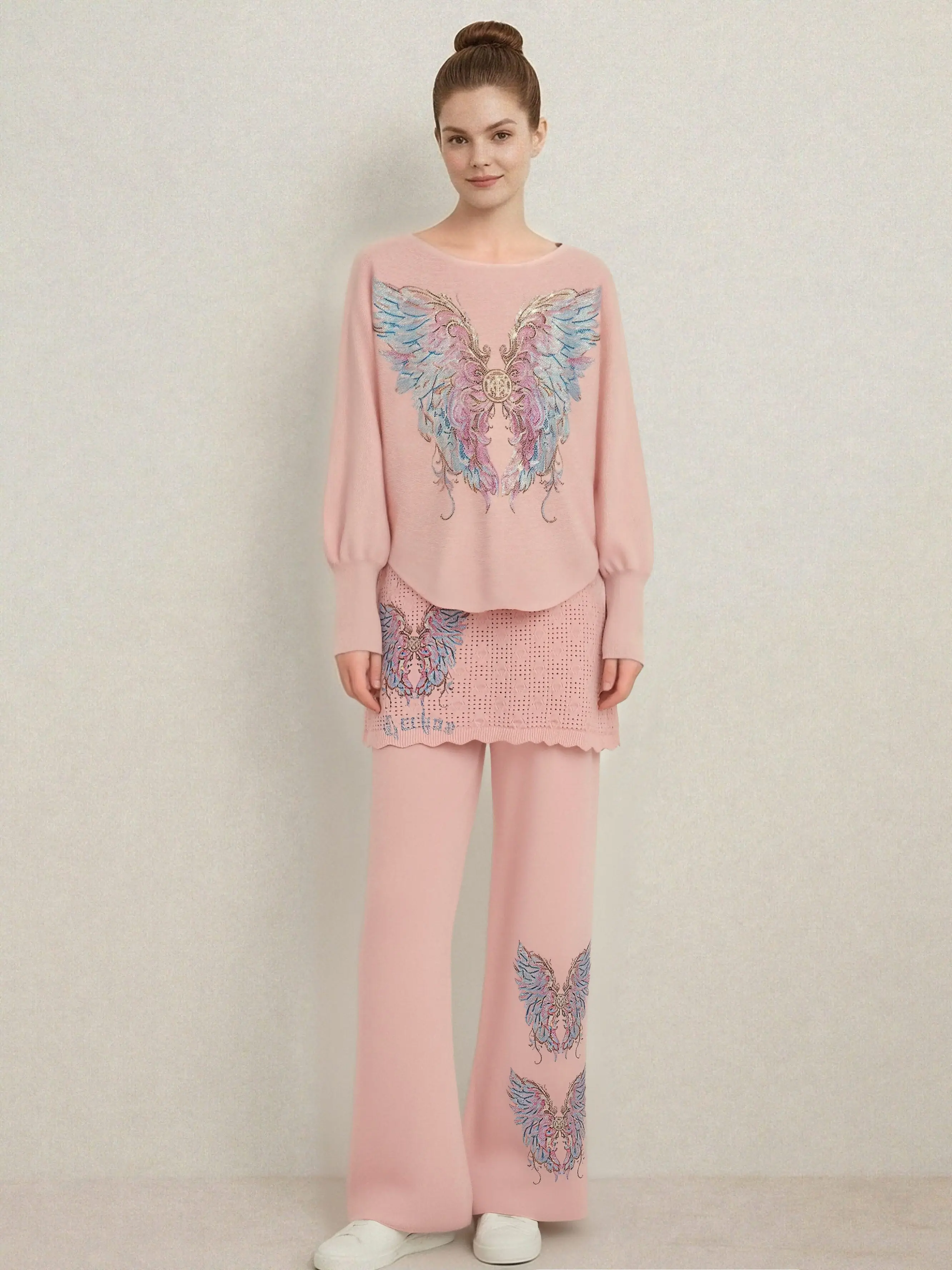 Woman wearing a pink outfit with butterfly designs on a plain background, TCH Rhinestone Angel Wings Layered Knit Top & Wide-Leg Pants Set